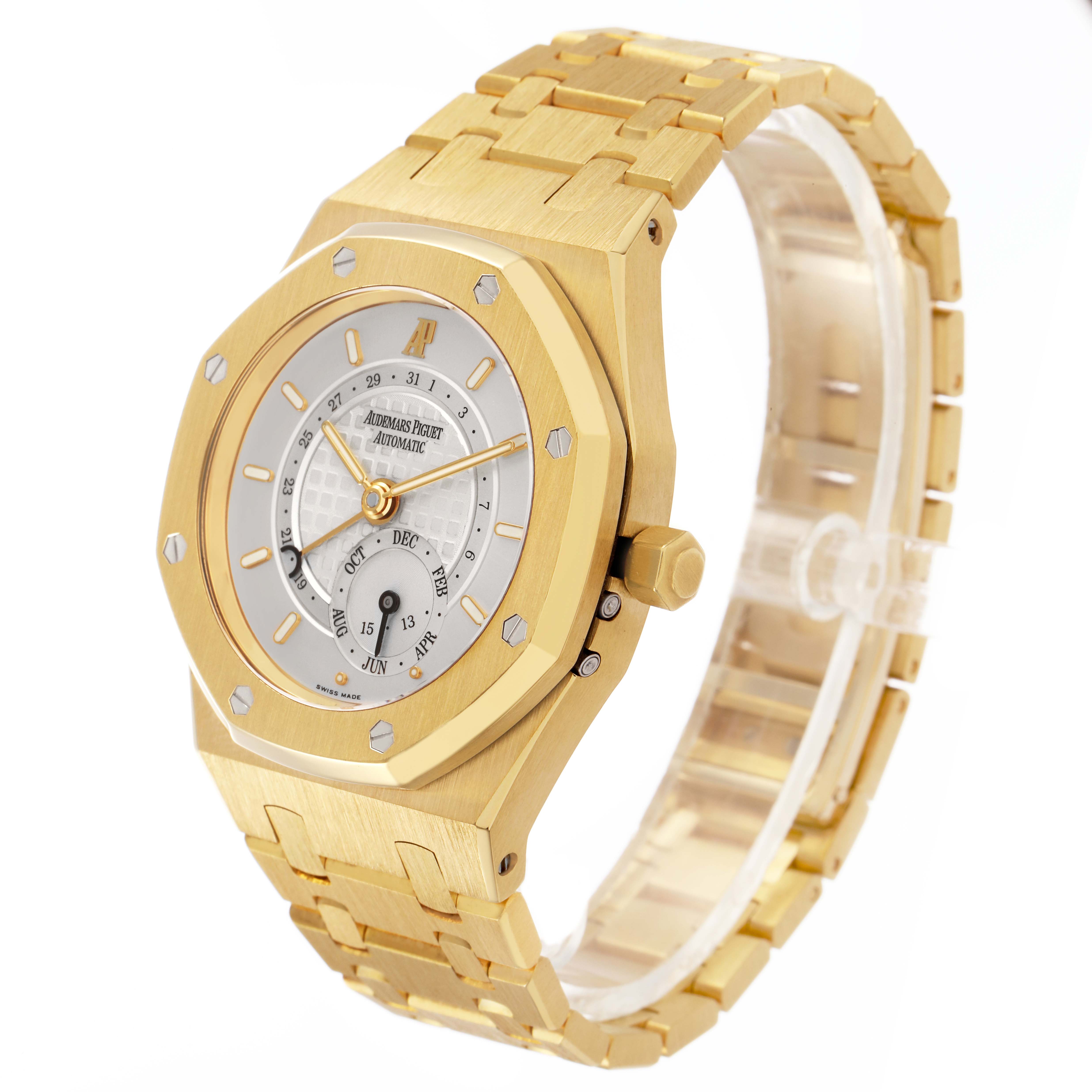 The Audemars Piguet Royal Oak 25920BA Men's Yellow Gold Silver Dial watch is shown at a three-quarter angle, highlighting its gold bracelet, bezel, and face.