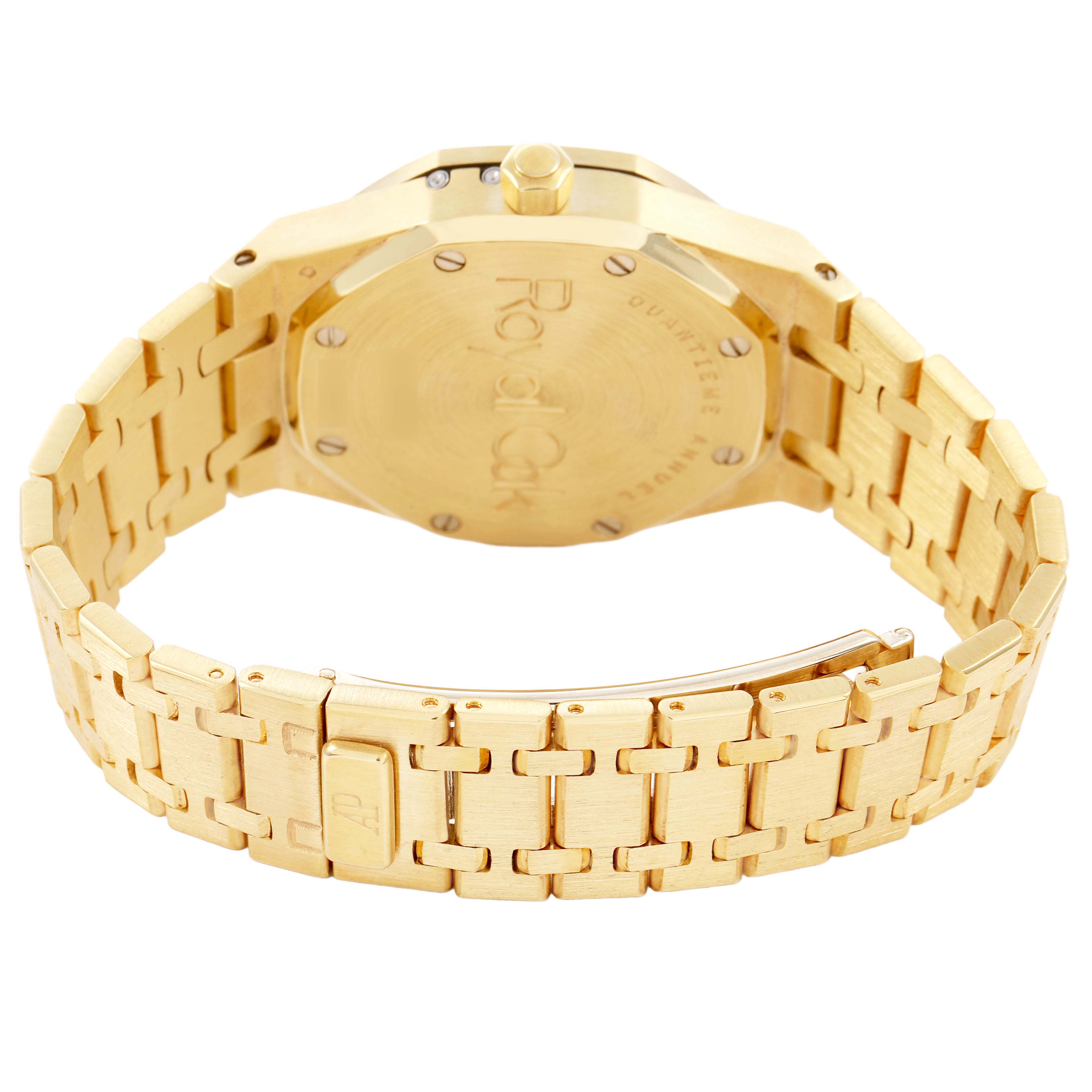 The image shows the back and clasp of a gold Audemars Piguet Royal Oak 25920BA Men's Yellow Gold Silver Dial watch at an angled view.