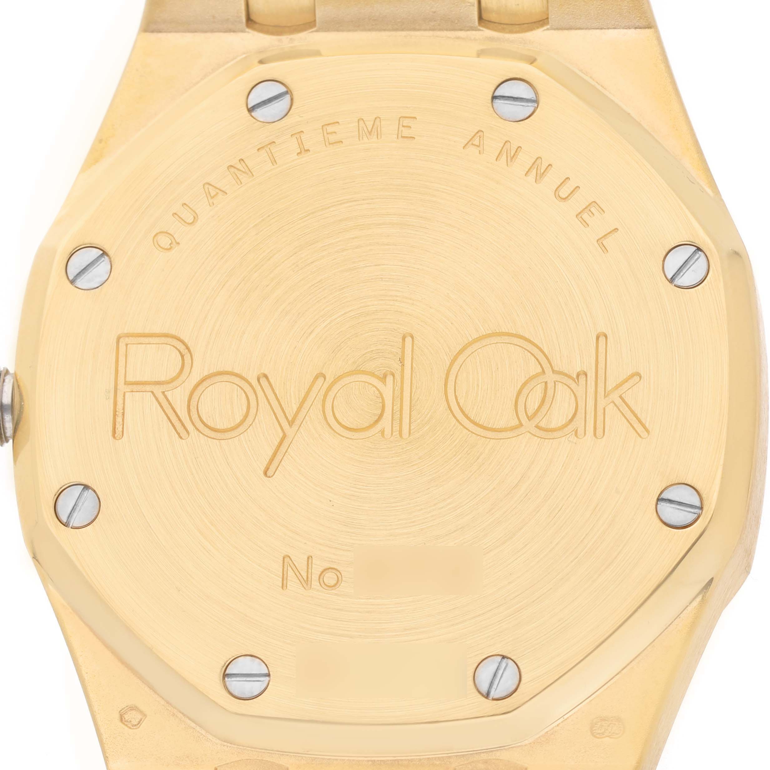 The image shows the back case of an Audemars Piguet Royal Oak 25920BA Men's Yellow Gold Silver Dial watch, highlighting the engraved details and screws.