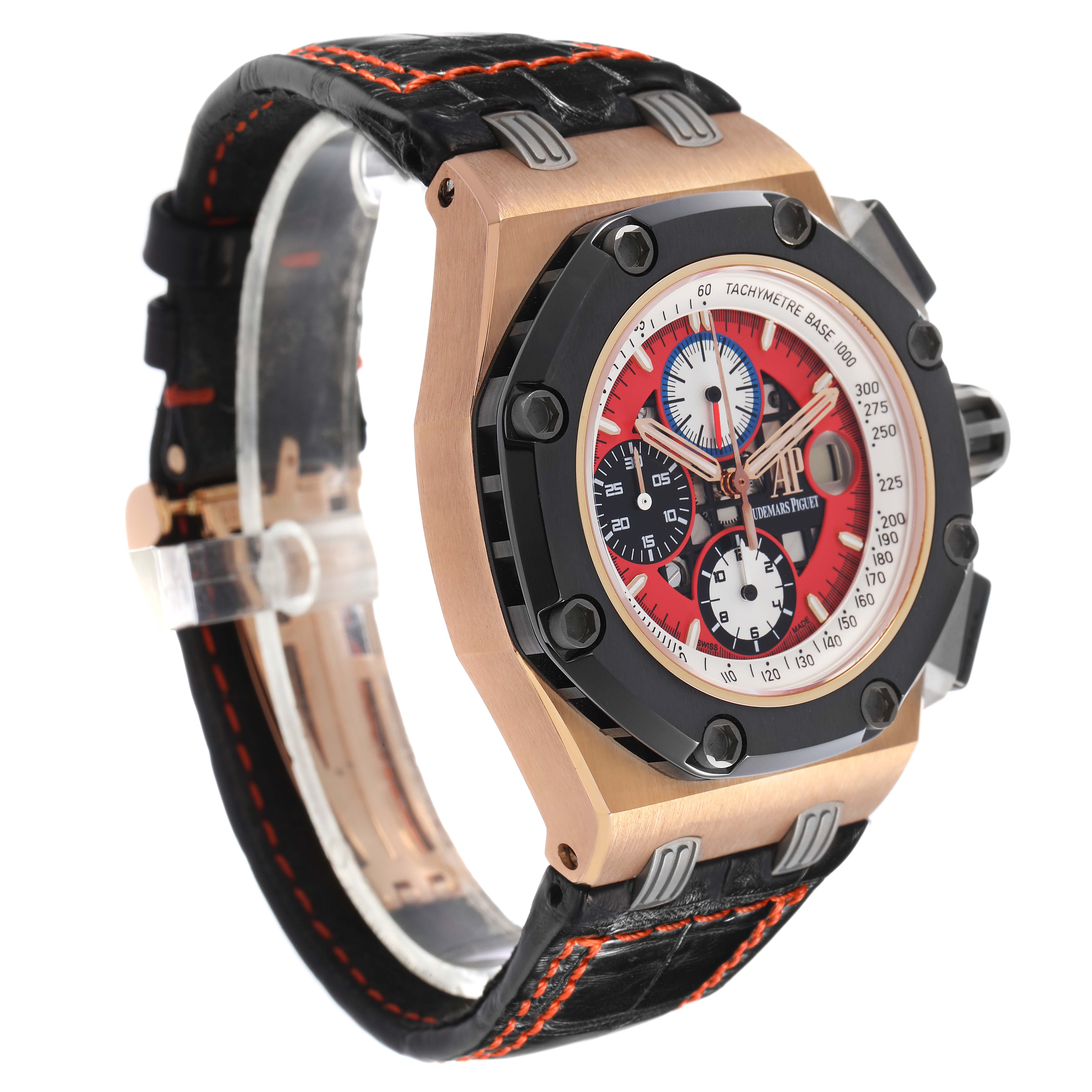 The Audemars Piguet Royal Oak Offshore 26284RO.OO.D002CR.01 Men's Rose Gold Red Dial is shown at a side angle, displaying the dial, case, bezel, and strap with detailed stitching.