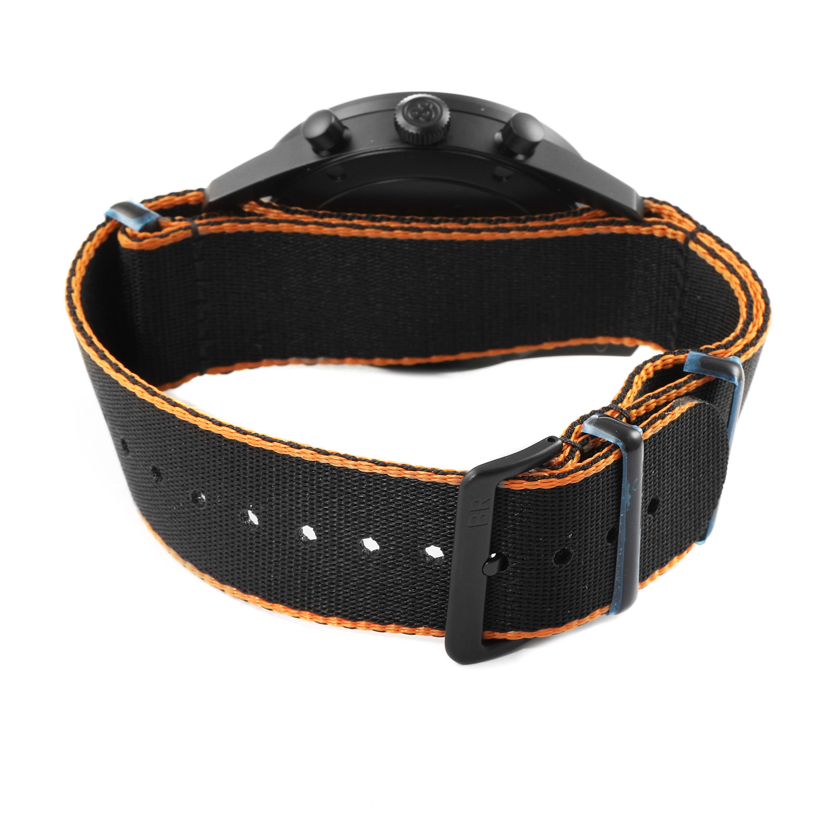 This Bell & Ross Vintage model watch is shown from the back, highlighting the black and orange fabric strap with its buckle and fasteners.