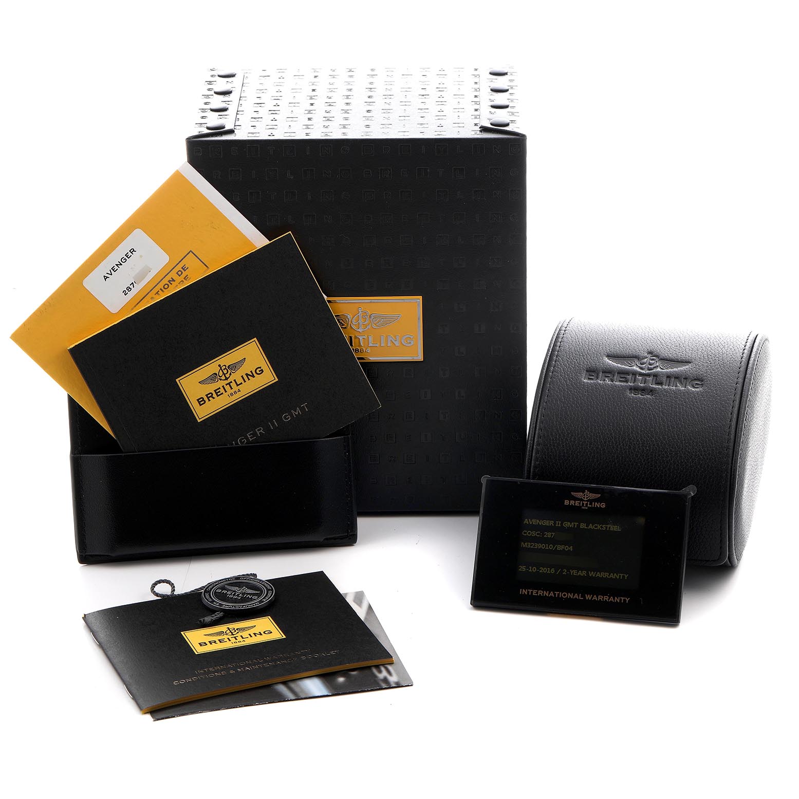The image shows packaging and accessories for the Breitling Avenger M3239010/BF04 Men's Stainless Steel Black Dial M3239010/BF04 Men's Stainless Steel Black Dial model, including boxes, booklets, warranty card, and case.