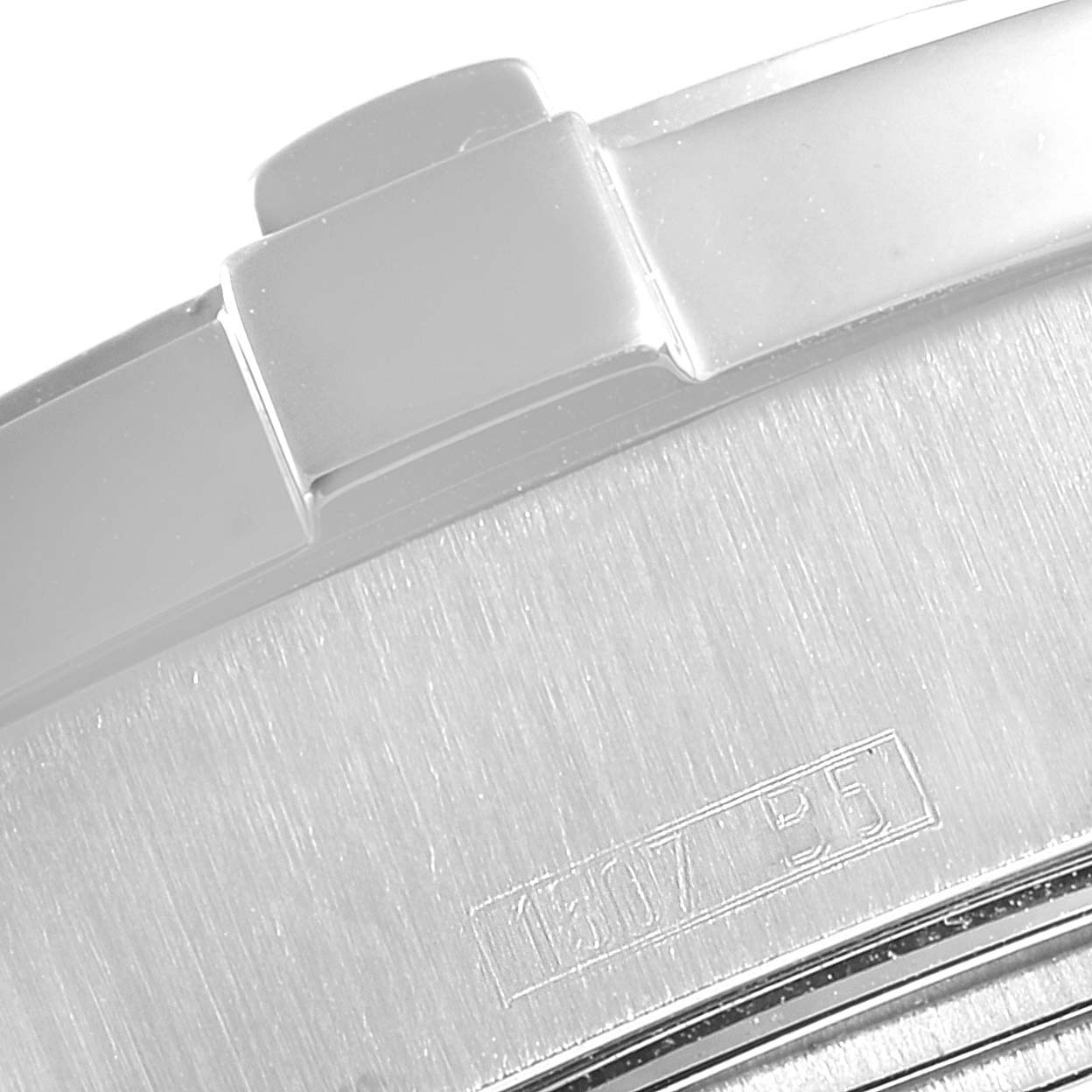 This image shows a close-up of the case back of a Breitling Superocean A17390 Men
s Stainless Steel Blue Dial A17390 Men
s Stainless Steel Blue Dial watch, displaying its brushed metal finish and serial number.