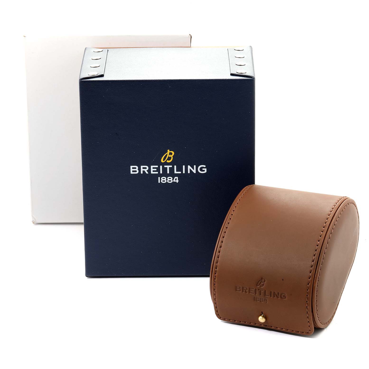 The image shows the packaging for the Superocean model by Breitling, including a blue box and a brown leather case.