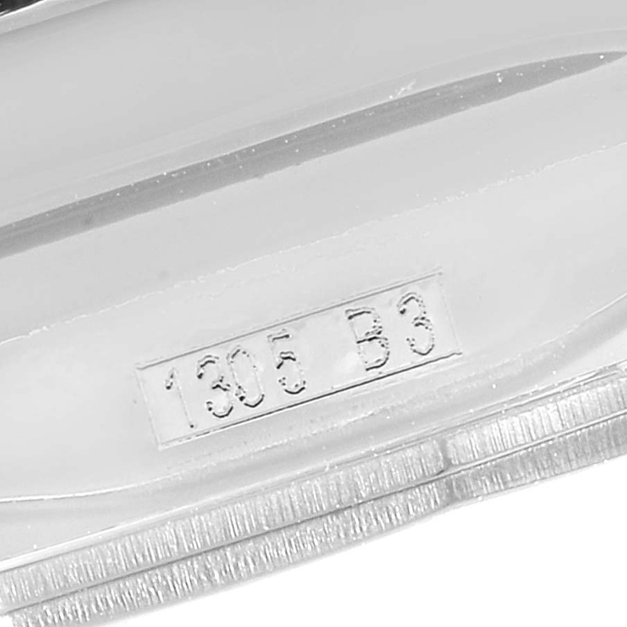This image shows a close-up of the serial number engraving on the case of a Bentley model watch by Breitling.
