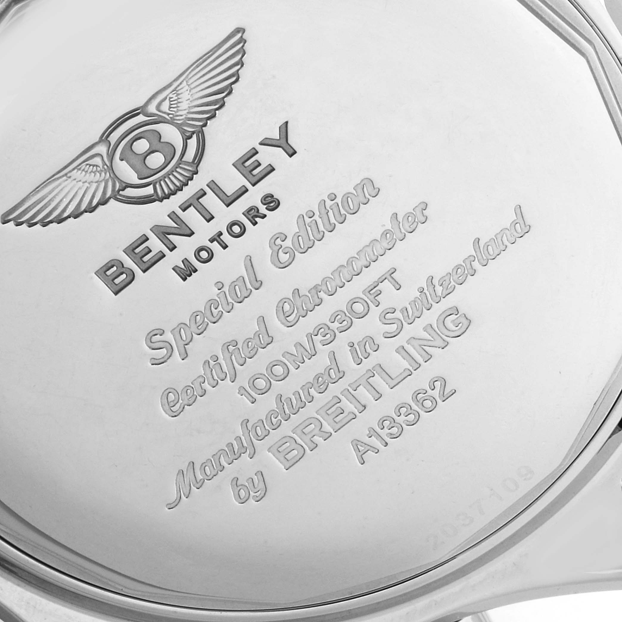 The image shows the back case of a Bentley model watch by Breitling, highlighting its engravings.