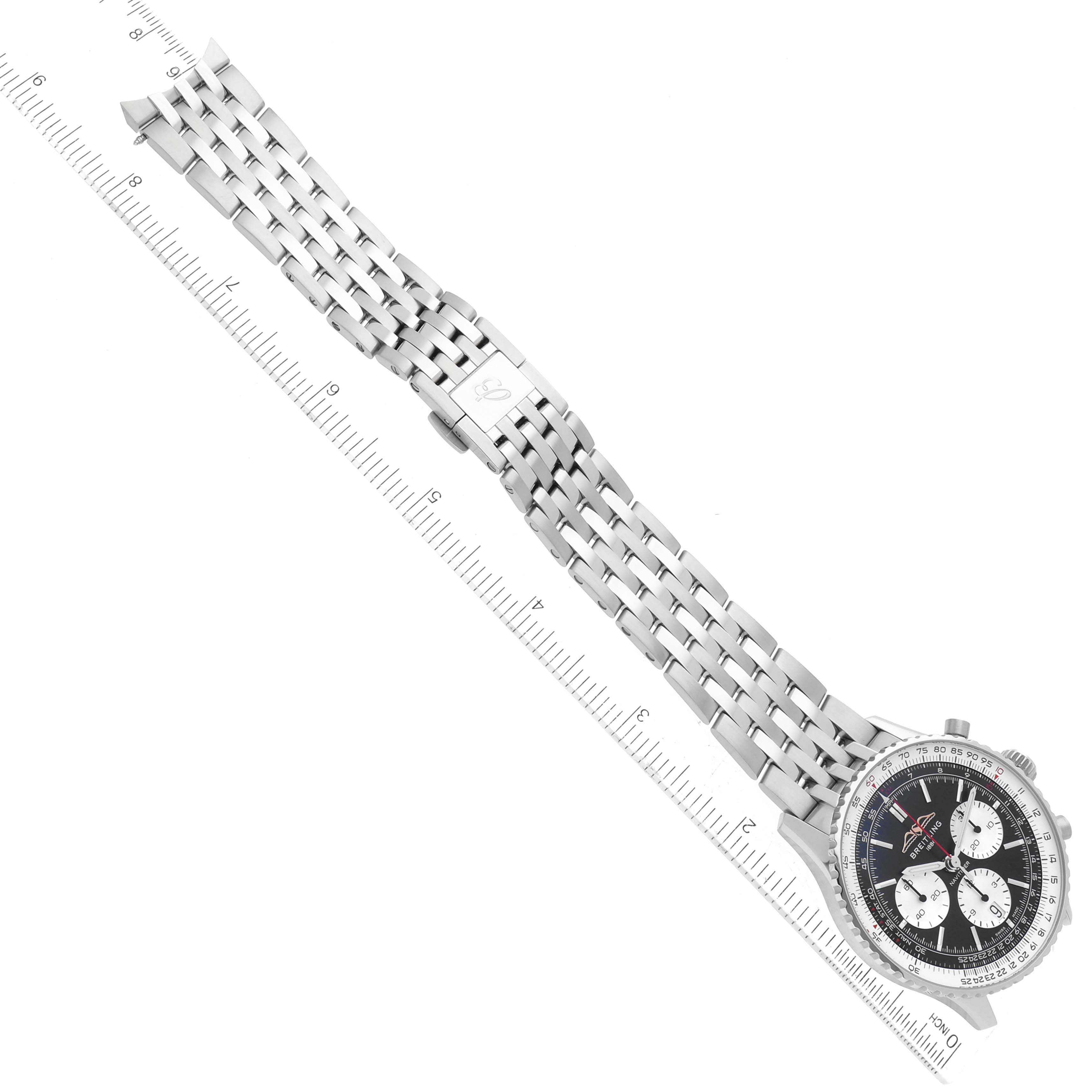 The image shows an aerial view of a Breitling Navitimer AB0138 Men's Stainless Steel Black Dial AB0138 Men's Stainless Steel Black Dial watch, highlighting the face, bezel, and metal bracelet with a ruler for scale.