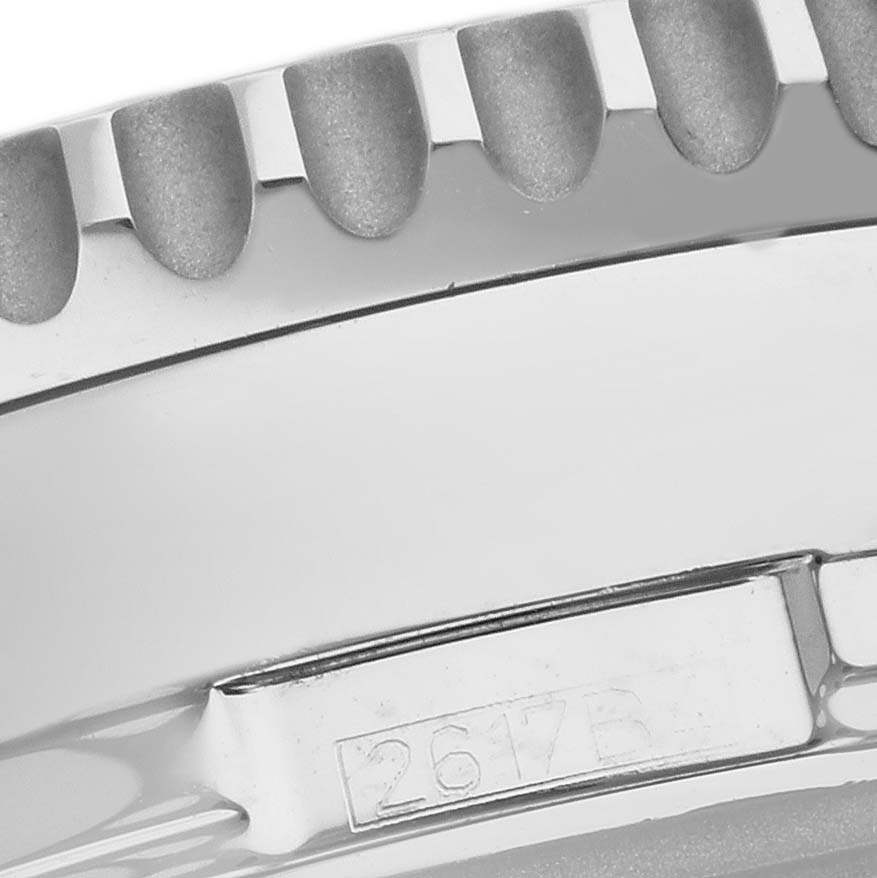The image shows a close-up of the bezel and part of the case back of a Breitling Navitimer A24322 Men's Stainless Steel Silver Dial A24322 Men's Stainless Steel Silver Dial watch.