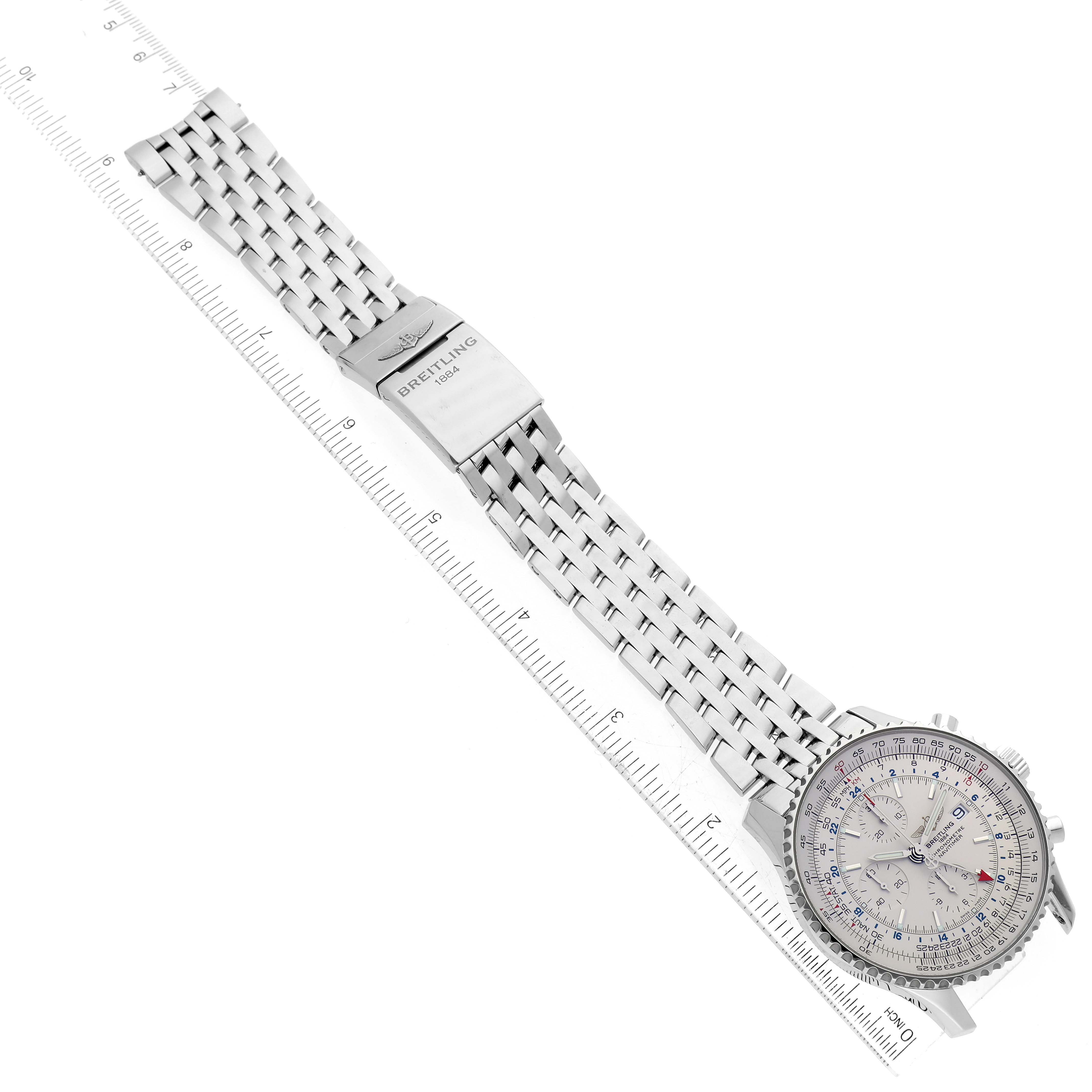 This image shows a Breitling Navitimer A24322 Men's Stainless Steel Silver Dial A24322 Men's Stainless Steel Silver Dial watch laid flat, displaying the face, bezel, and metal bracelet alongside a ruler.