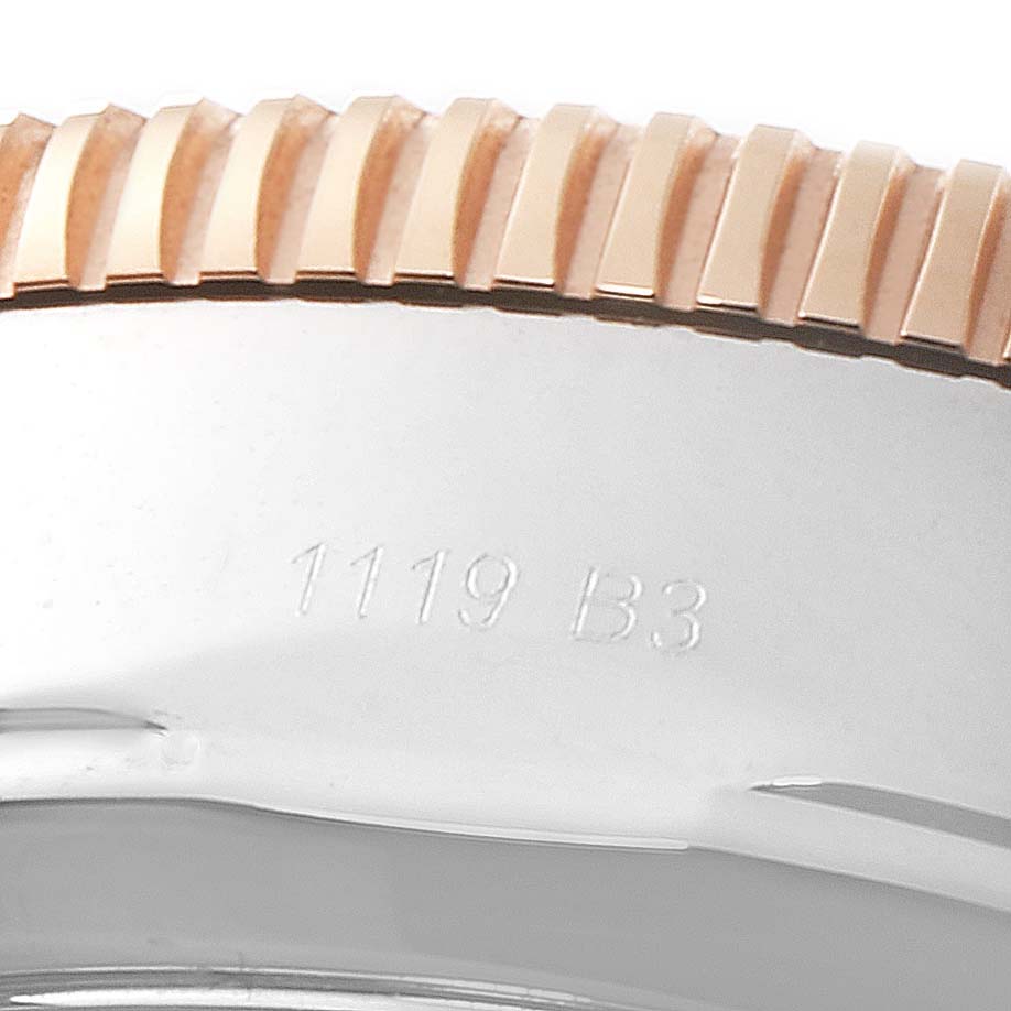 The image shows a close-up view of the side of a Breitling Superocean U1331312/BG50/279S/A20D.4 Men
s Steel and Gold (two tone) Black Dial U1331312/BG50/279S/A20D.4 Men
s Steel and Gold (two tone) Black Dial watch, highlighting the bezel and an engraved serial number.