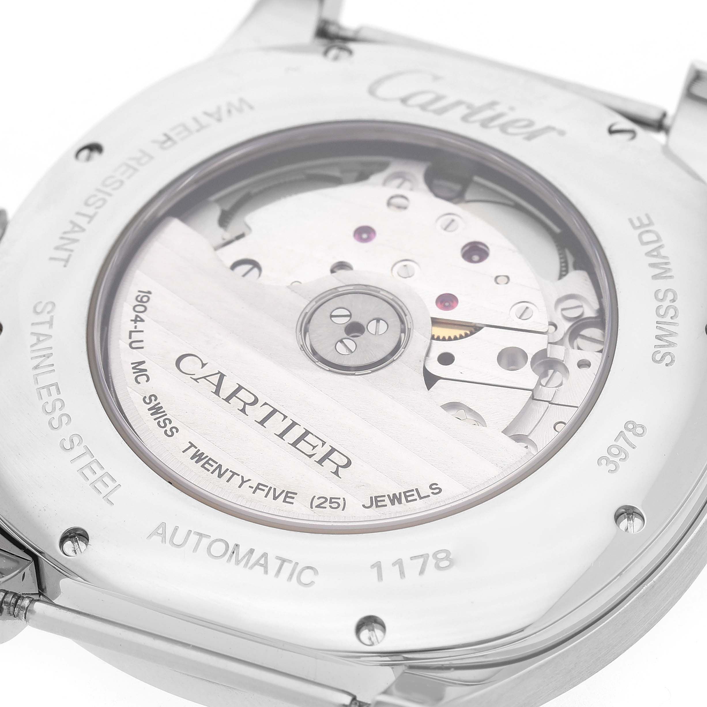 The image shows the back of a Drive de Cartier watch by Cartier, featuring its automatic movement and engravings.