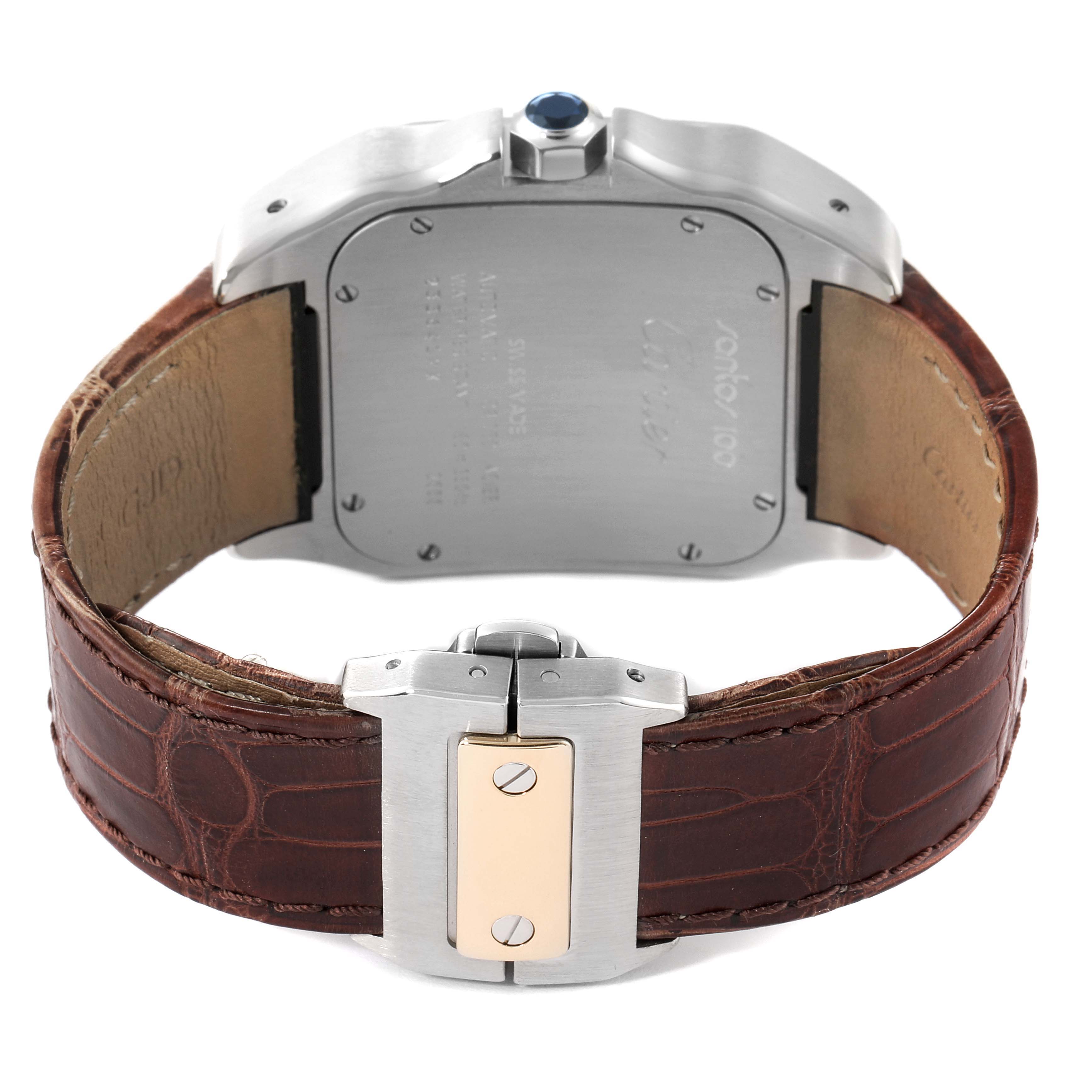 The image shows the backside of the Cartier Santos W20072X7 Men's Steel and Gold (two tone) Silver Dial W20072X7 Men's Steel and Gold (two tone) Silver Dial watch with its brown leather strap and clasp clearly visible.