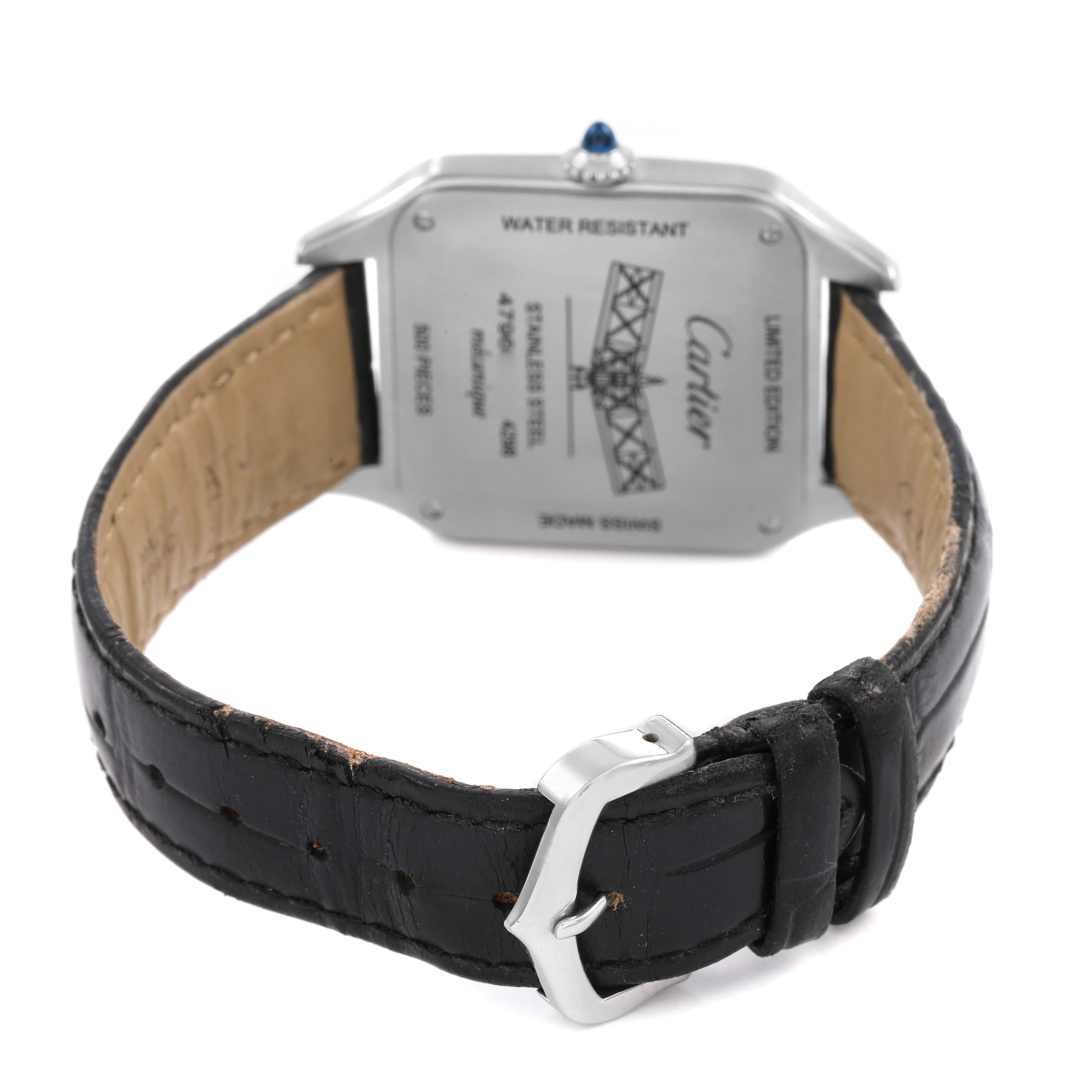 The image shows the back view of a Cartier Santos Dumont W2SA0015 Men's Steel and Gold (two tone) Black Dial watch, highlighting the case back and black leather strap.