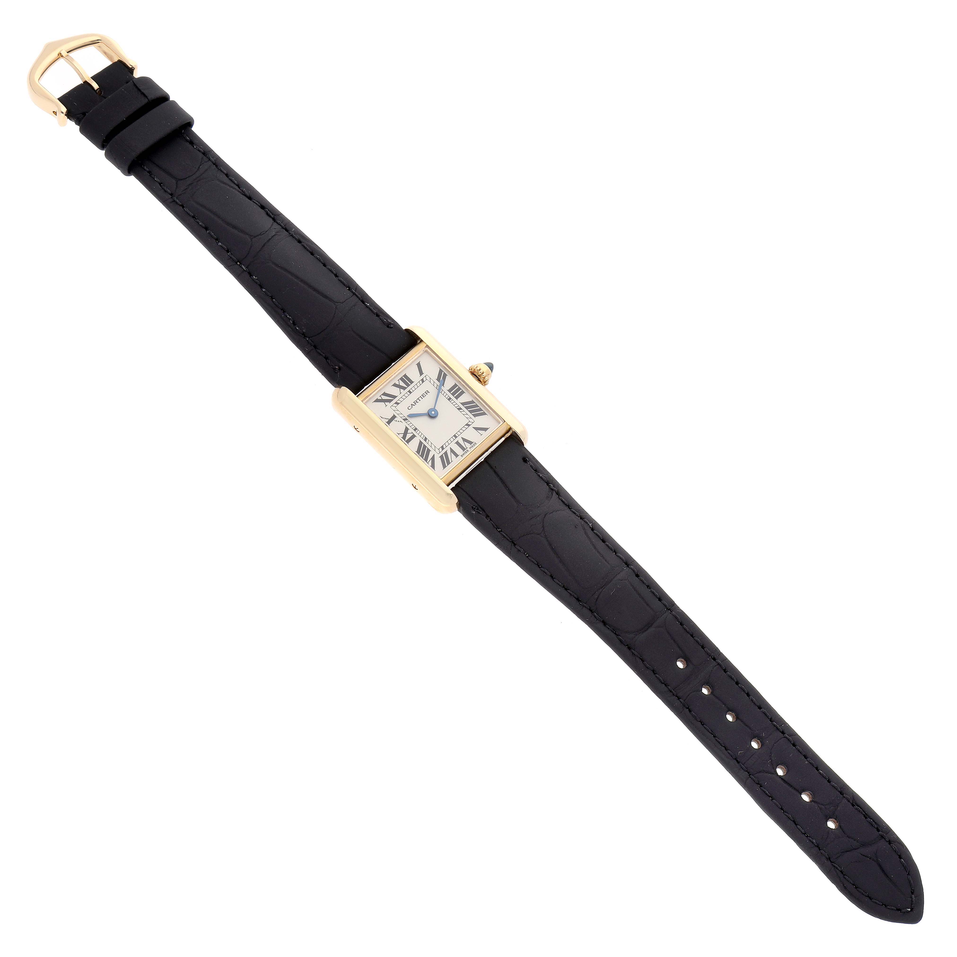 The image shows the Cartier Tank Louis W1529856 Women's Yellow Gold Silver Dial W1529856 Women's Yellow Gold Silver Dial model watch, including its rectangular face, gold case, and black leather strap, from a top-down angle.