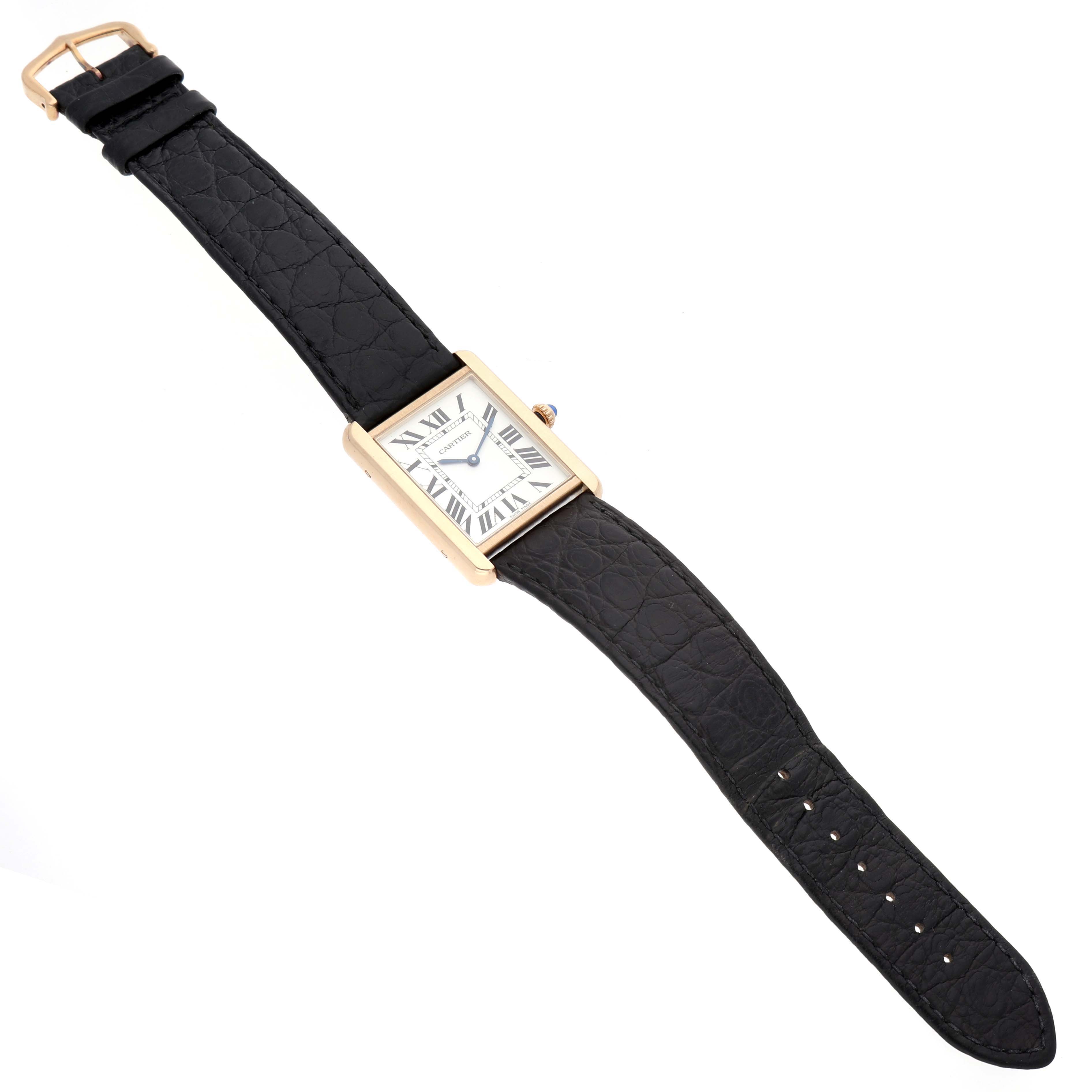 The Cartier Tank Solo W5200025 Men's Yellow Gold Silver Dial watch is shown from a top view, featuring its full rectangular face, leather strap, and buckle.