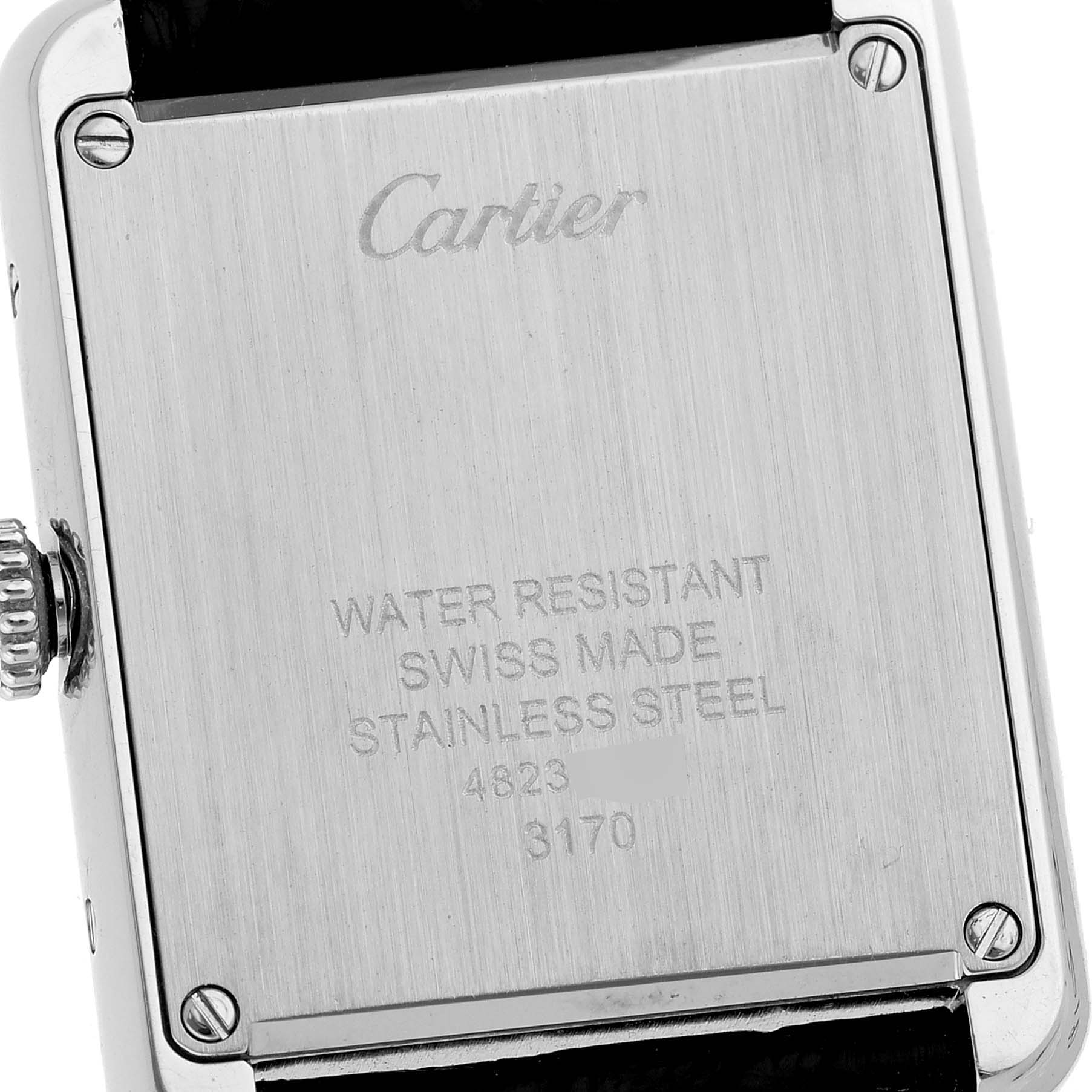 The image shows the back case of a Cartier Tank Solo WSTA0030 Women's Stainless Steel Silver Dial watch, highlighting the brand engraving and specifications.