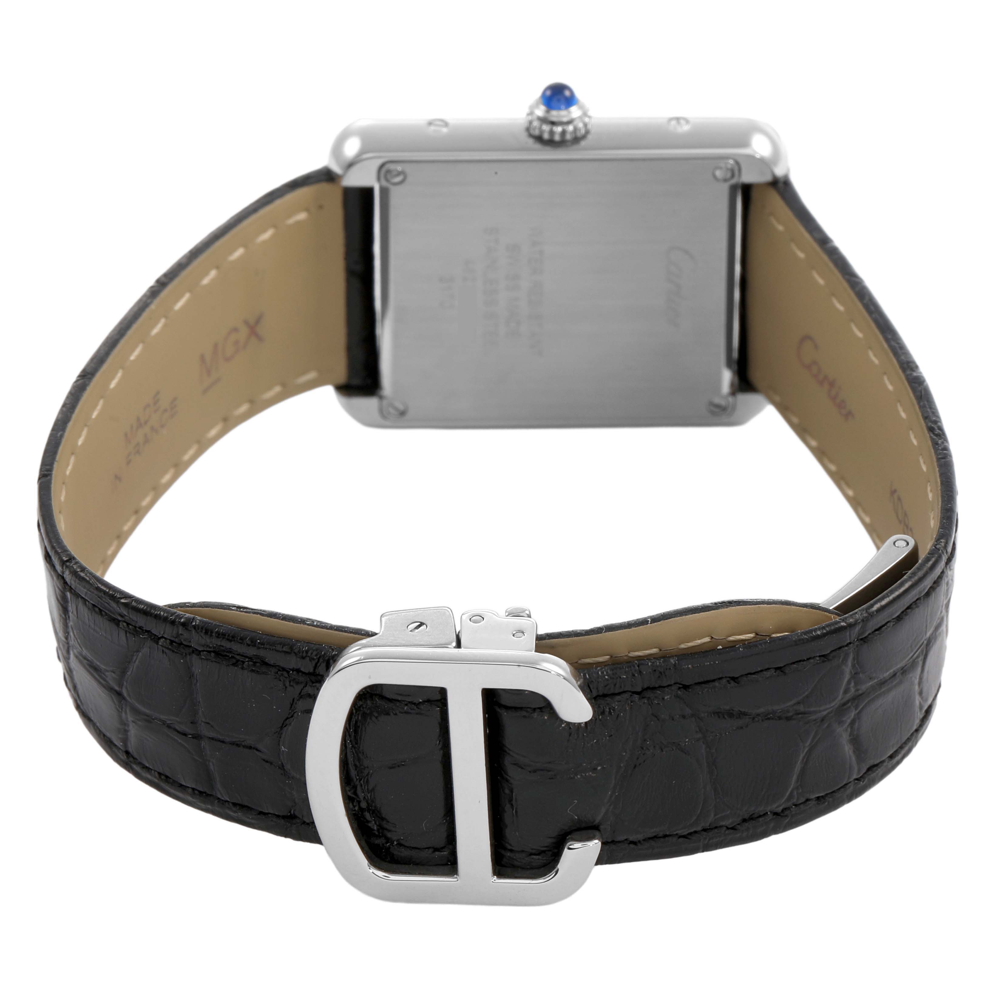 The watch, a Cartier Tank Solo WSTA0030 Women's Stainless Steel Silver Dial model, is shown from the back, highlighting the case, strap, and buckle.