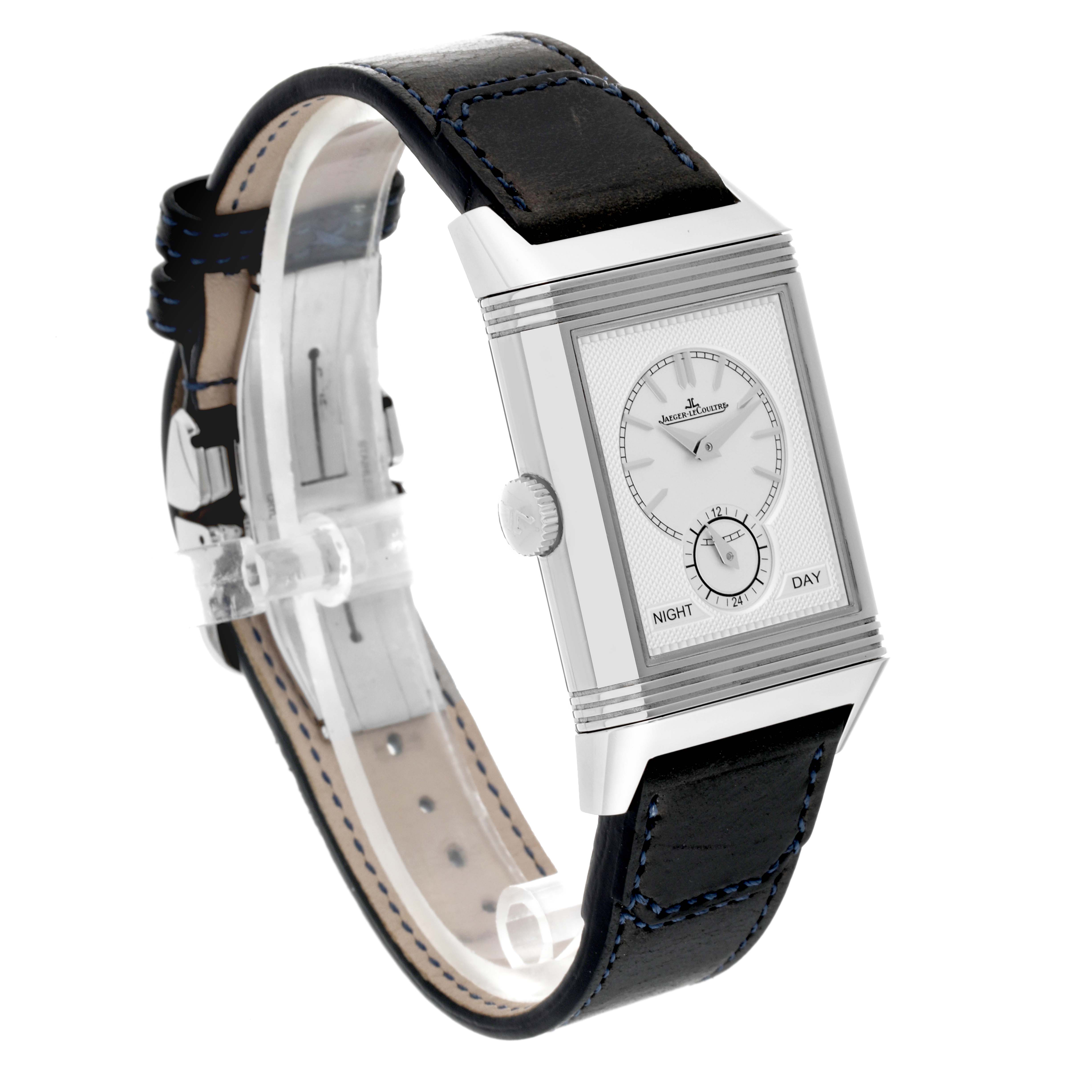 The image shows a Jaeger LeCoultre Reverso Q3988482 Men's Stainless Steel Blue Dial Q3988482 Men's Stainless Steel Blue Dial model watch angled to display the face, side crown, and part of the leather strap.