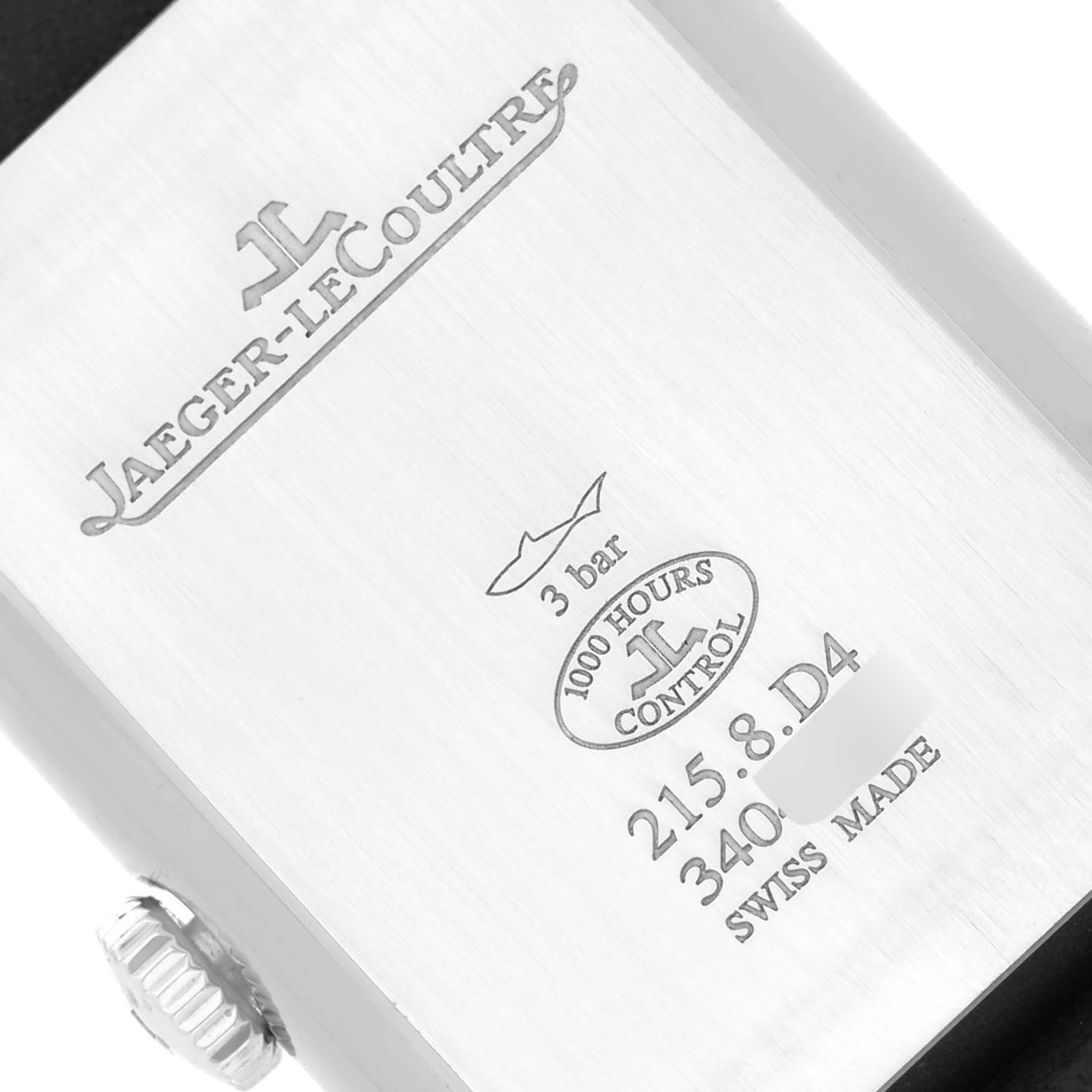 This image shows the back case of a Jaeger-LeCoultre Reverso watch, including its crown and engraved details.
