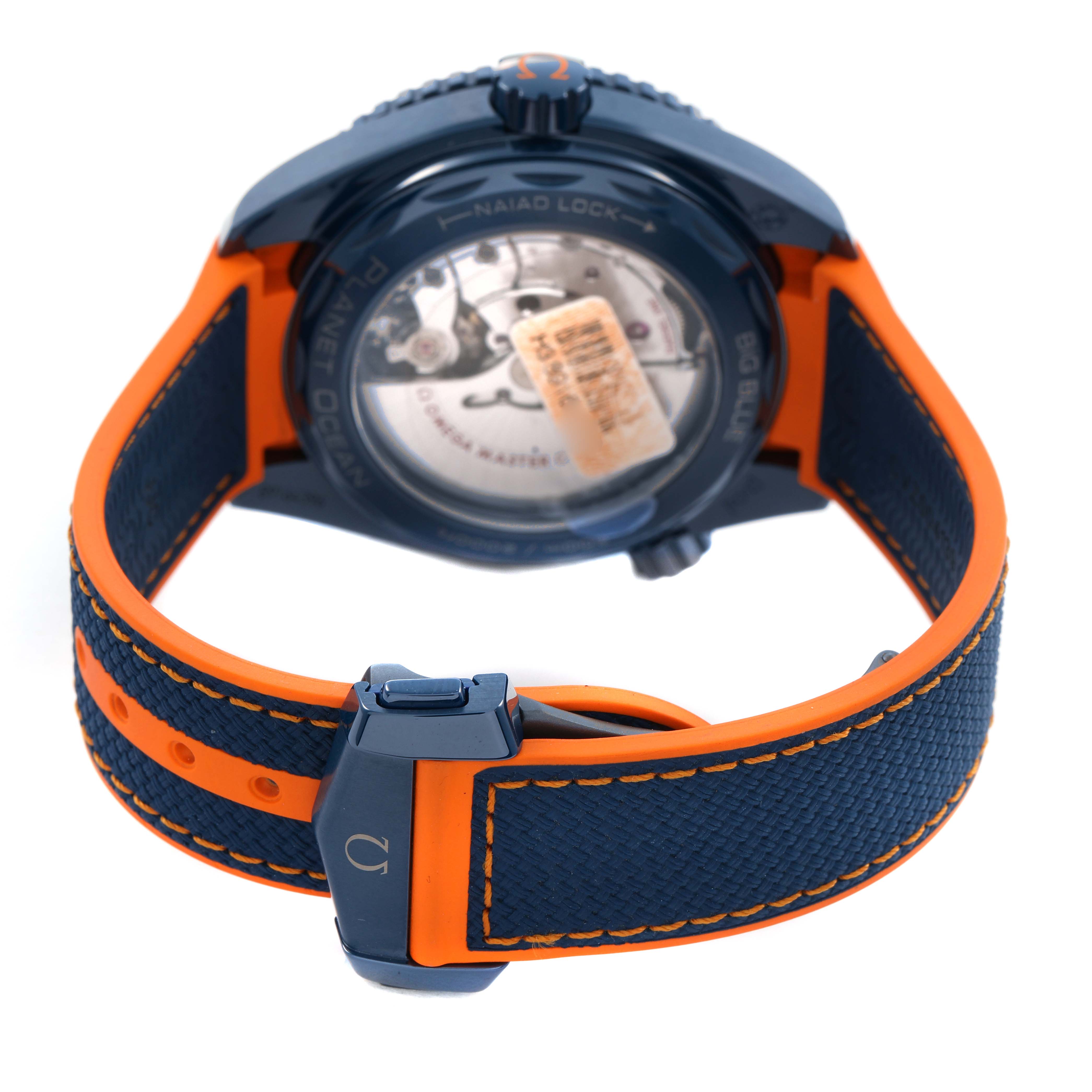 The Omega Planet Ocean 215.92.46.22.03.001 Men's Ceramic Blue Dial watch is shown from the back, highlighting the case back, strap, and clasp.
