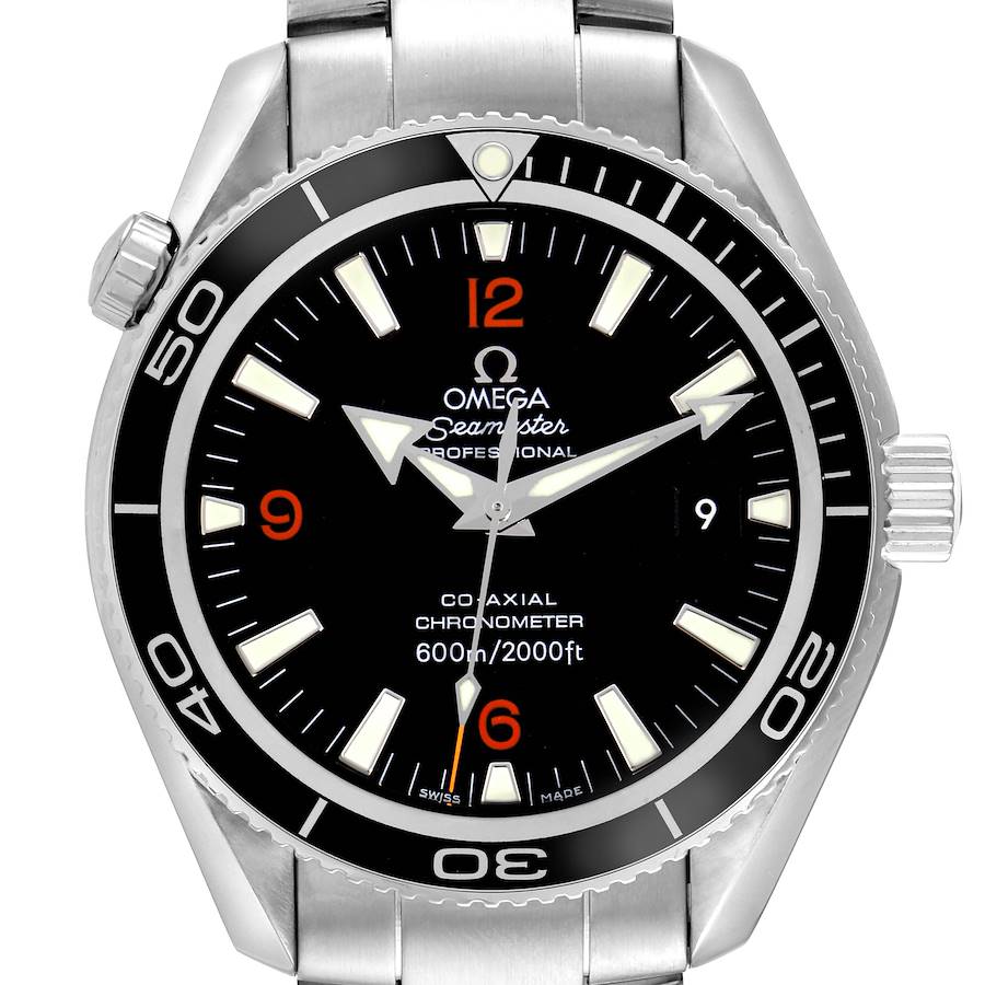 The Omega Planet Ocean watch is shown from a front angle, highlighting the dial, bezel, crown, and part of the bracelet.