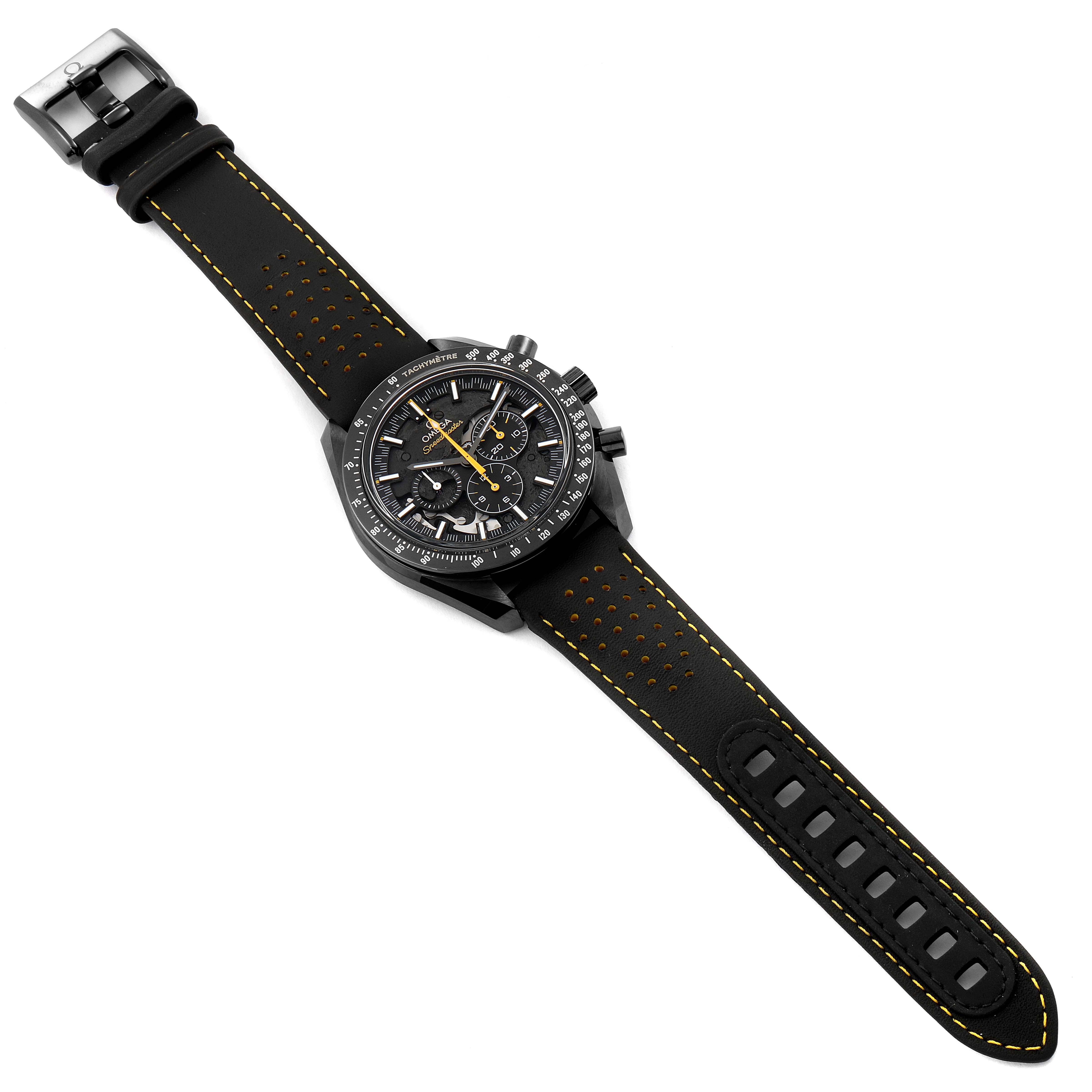This image shows a top-down view of an Omega Speedmaster 311.92.44.30.01.001 Men's Titanium Black Dial 311.92.44.30.01.001 Men's Titanium Black Dial watch, highlighting its black strap with yellow stitching and perforations, and its detailed dial.