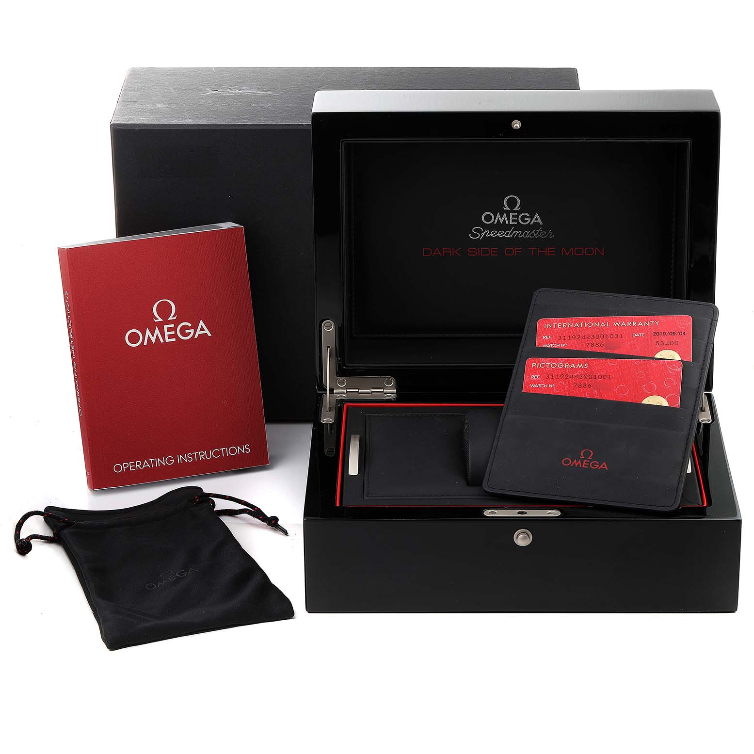 The image shows an Omega Speedmaster 311.92.44.30.01.001 Men's Titanium Black Dial 311.92.44.30.01.001 Men's Titanium Black Dial watch box, operating instructions, warranty cards, and a pouch, all viewed from the top.