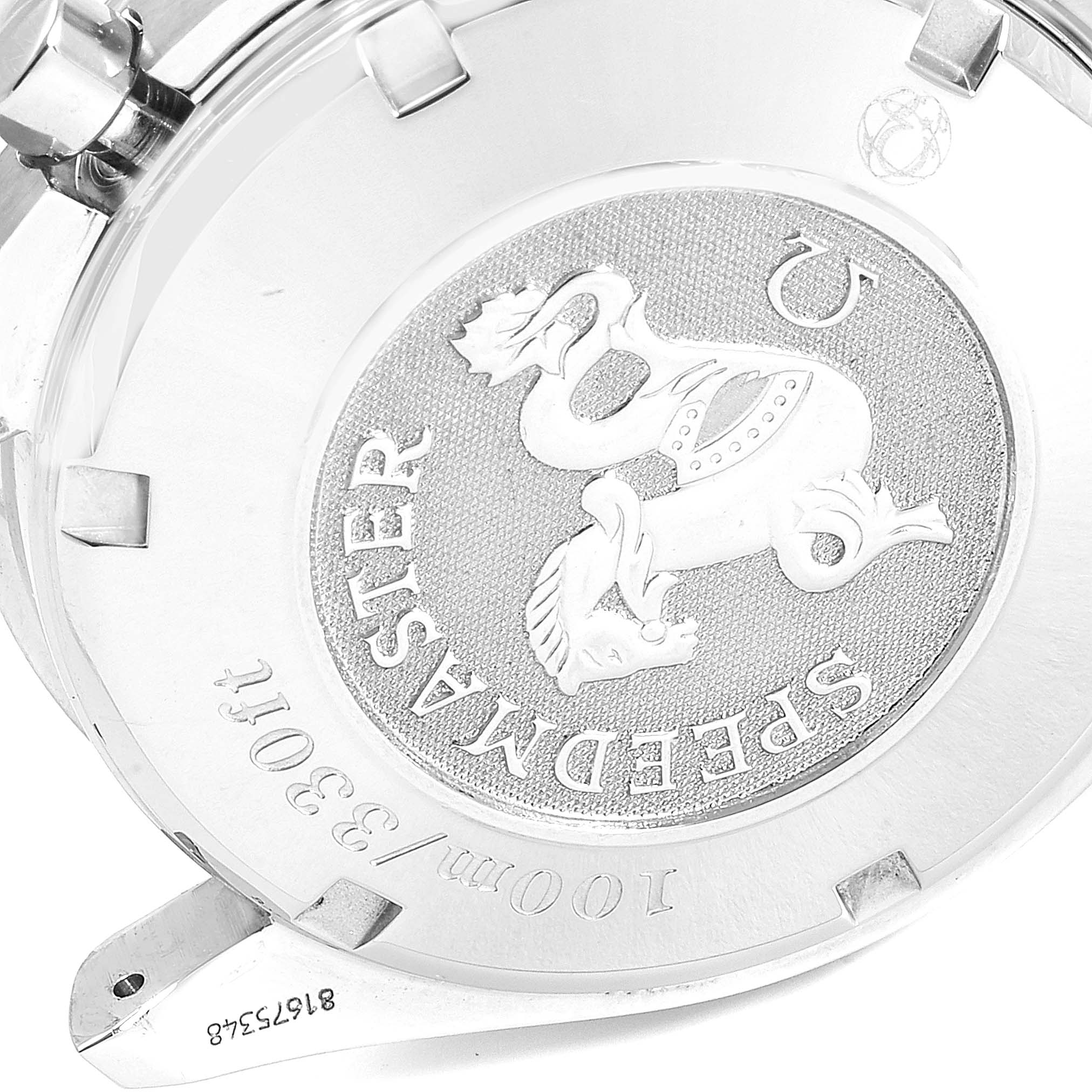 This image shows the engraved case back of an Omega Speedmaster 3211.31.00 Men's Stainless Steel Silver Dial 3211.31.00 Men's Stainless Steel Silver Dial watch at an angled view.