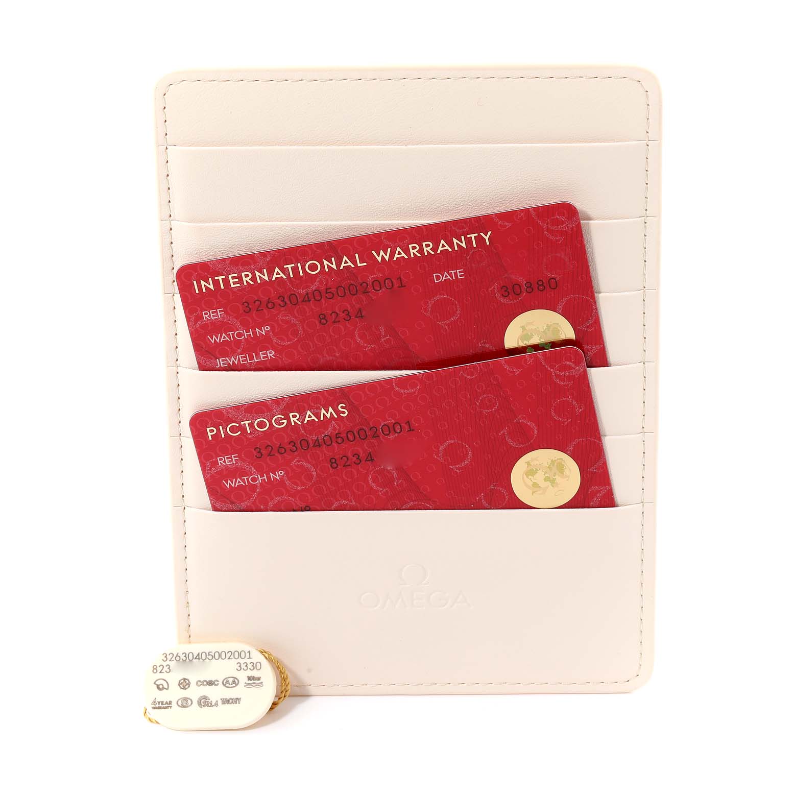 This image shows the warranty cards and tags for an Omega Speedmaster 326.30.40.50.02.001 Men
s Stainless Steel Silver Dial 326.30.40.50.02.001 Men
s Stainless Steel Silver Dial watch.