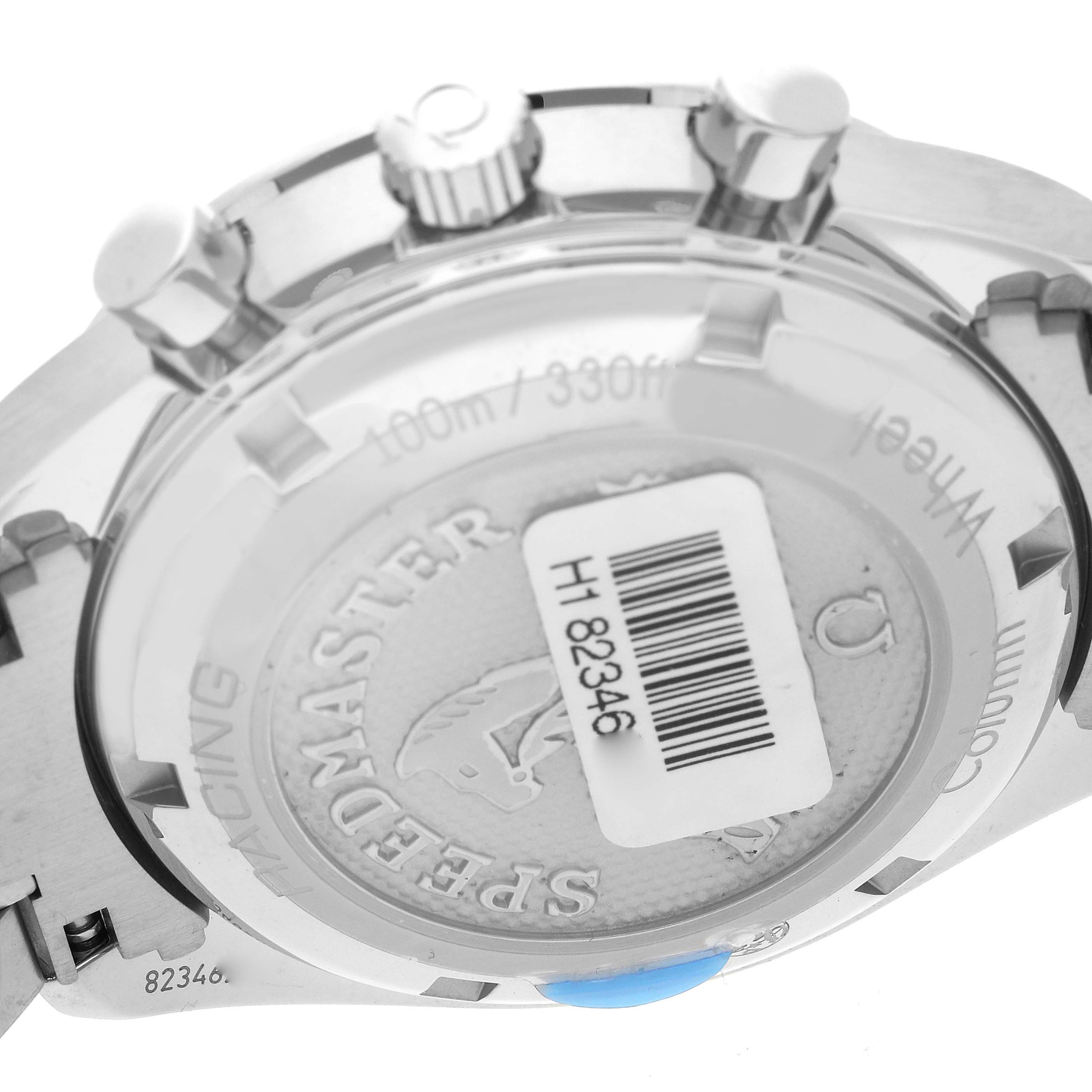 The image shows the back case and crown of an Omega Speedmaster 326.30.40.50.02.001 Men
s Stainless Steel Silver Dial 326.30.40.50.02.001 Men
s Stainless Steel Silver Dial watch, displaying the model name and some text.