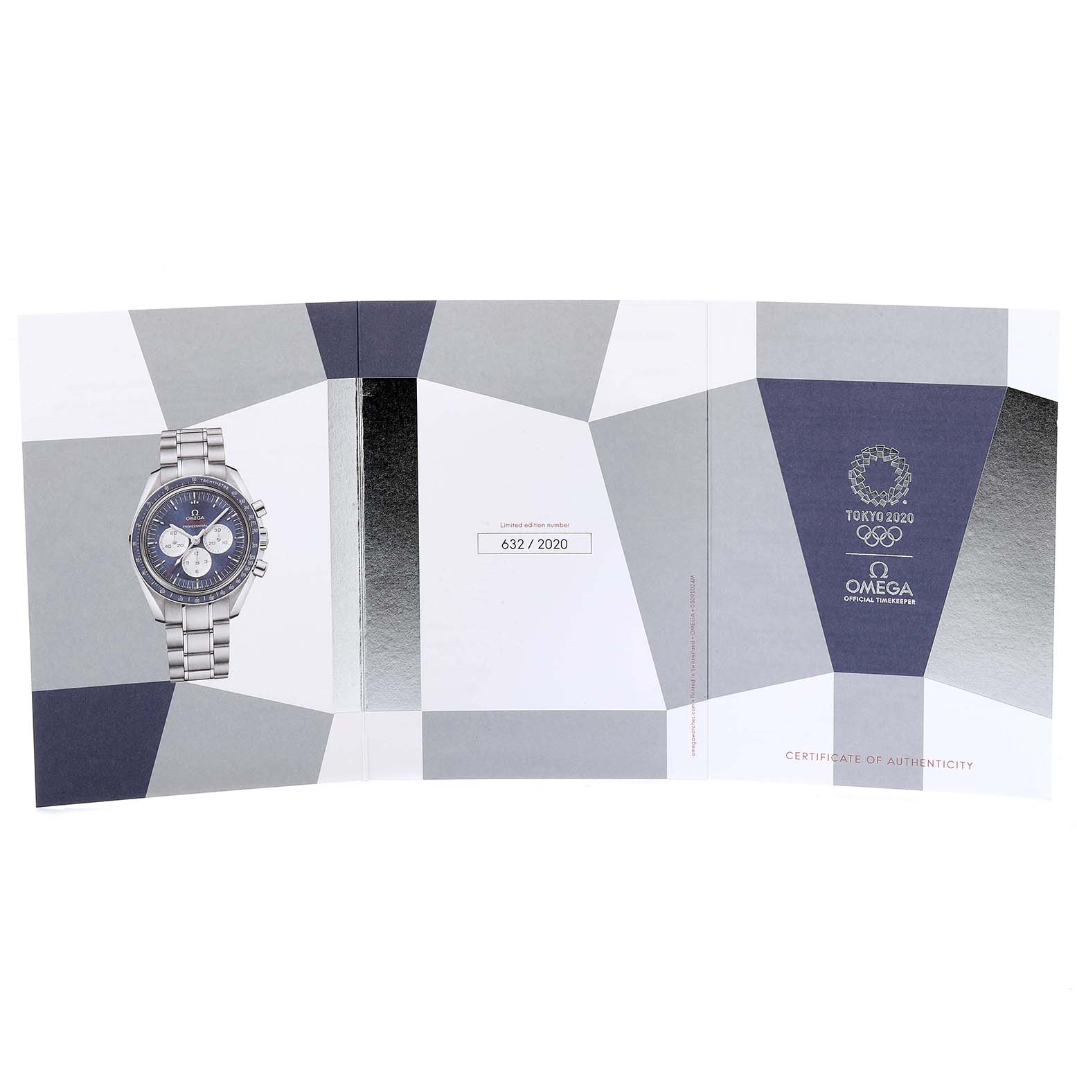 The image shows the Omega Speedmaster 522.30.42.30.03.001 Men's Stainless Steel Blue Dial 522.30.42.30.03.001 Men's Stainless Steel Blue Dial watch in the center of a certificate of authenticity booklet for the Tokyo 2020 edition.