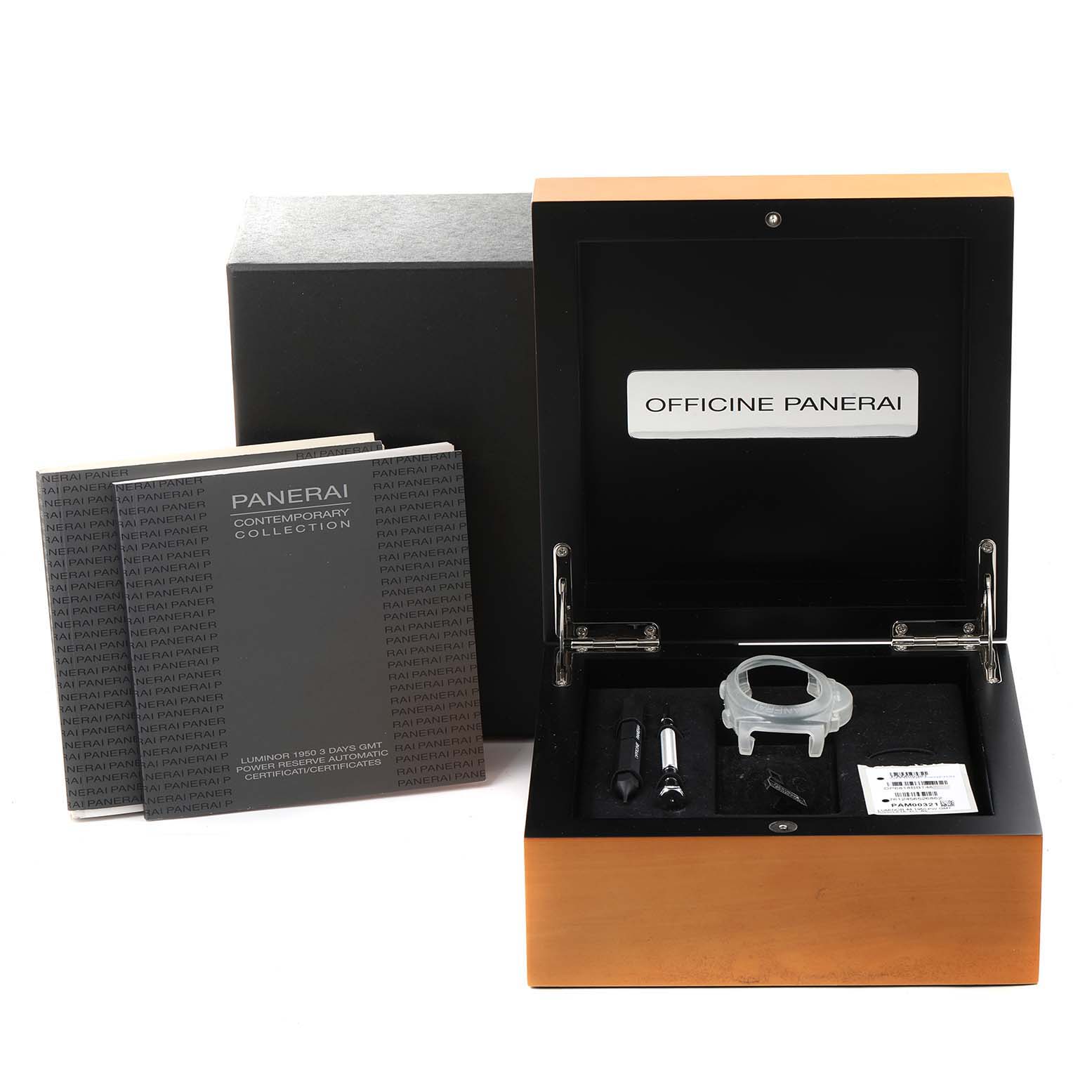 The image shows a Panerai Luminor PAM00321 Men's Stainless Steel Black Dial PAM00321 Men's Stainless Steel Black Dial watch box with manuals, a watch cover, and repair tools from a top-down angle.