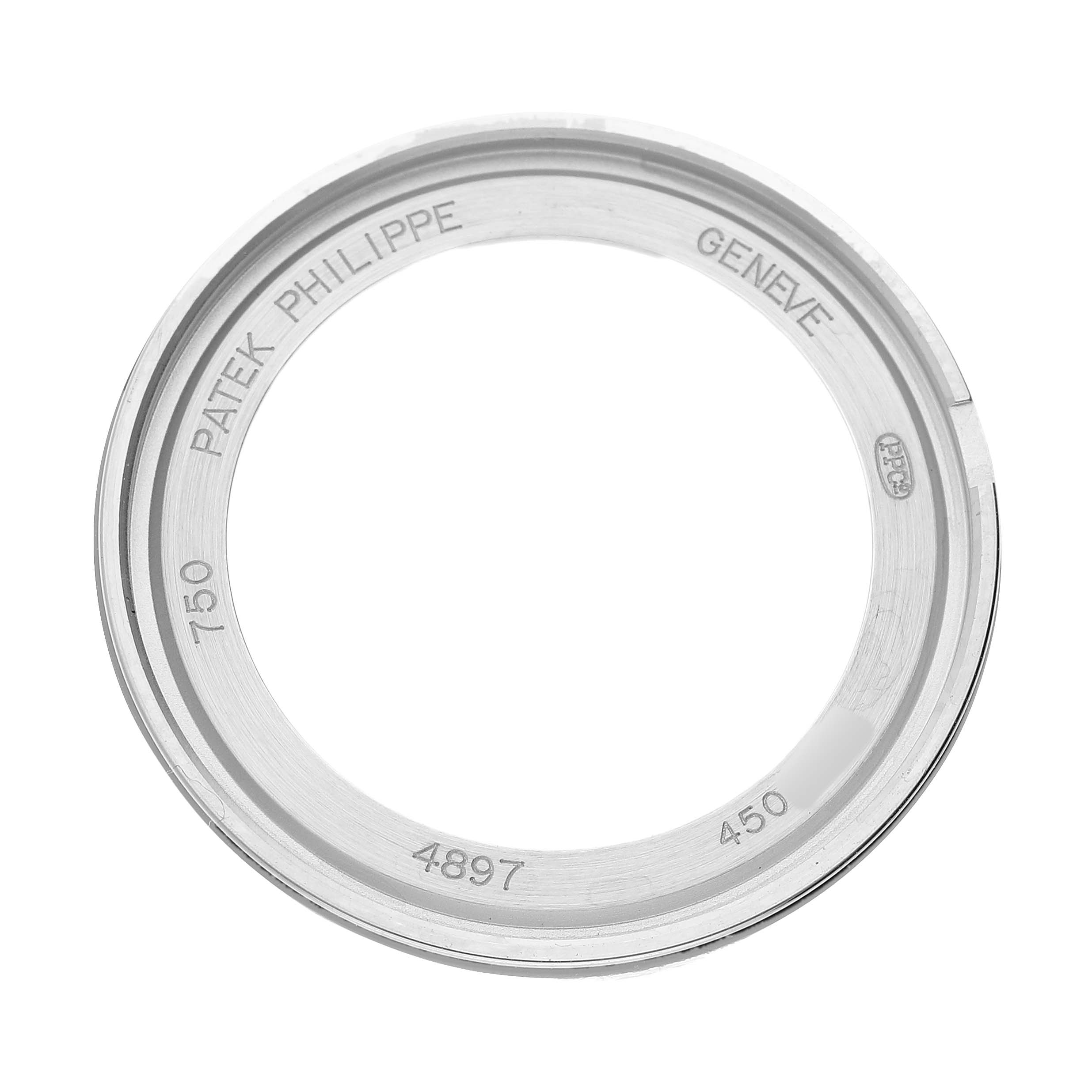 The image shows the bezel of a Patek Philippe Calatrava 4897G Women's White Gold Blue Dial, viewed from above.