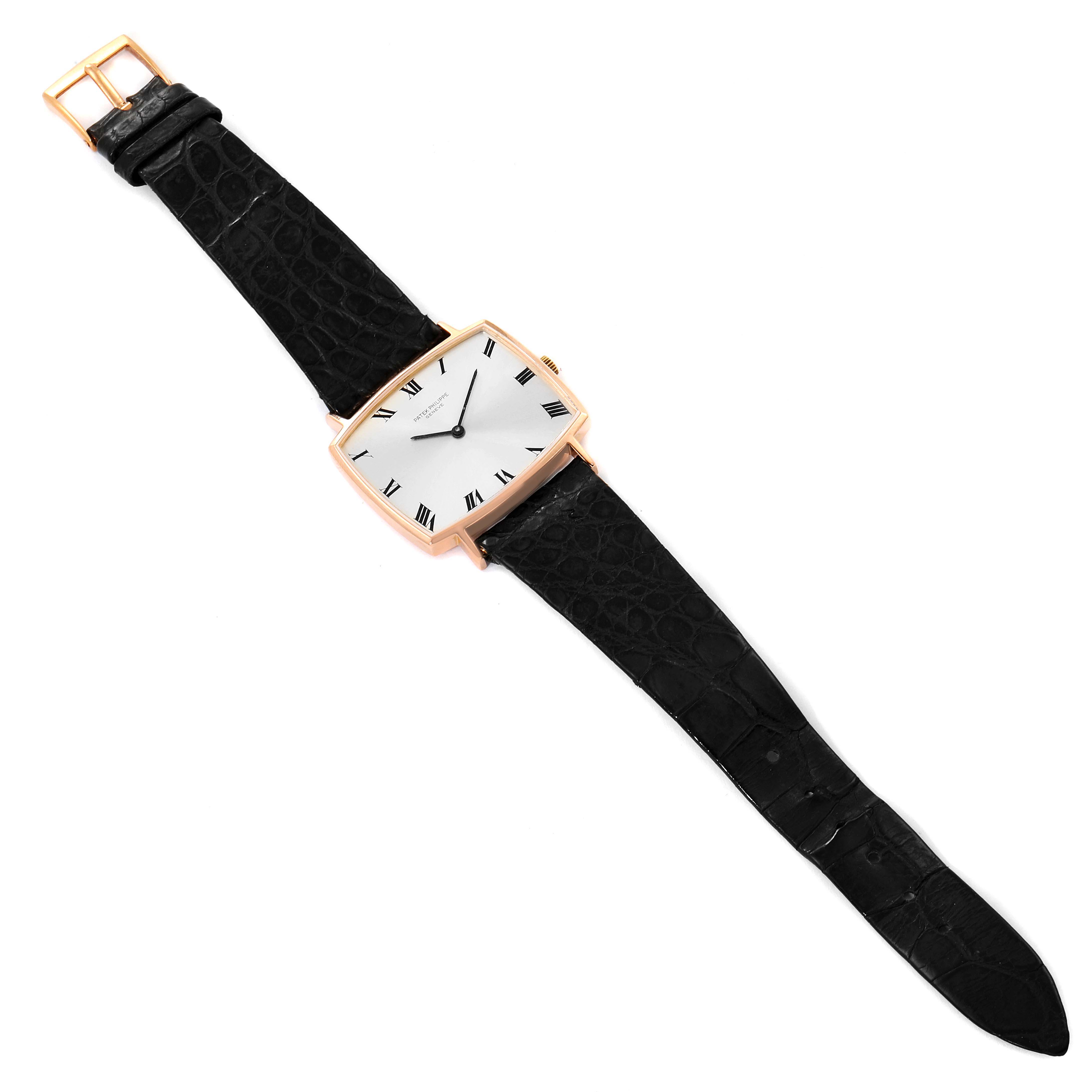 The image shows a top-view angle of a Vintage Patek Philippe watch with a square case and black leather strap.