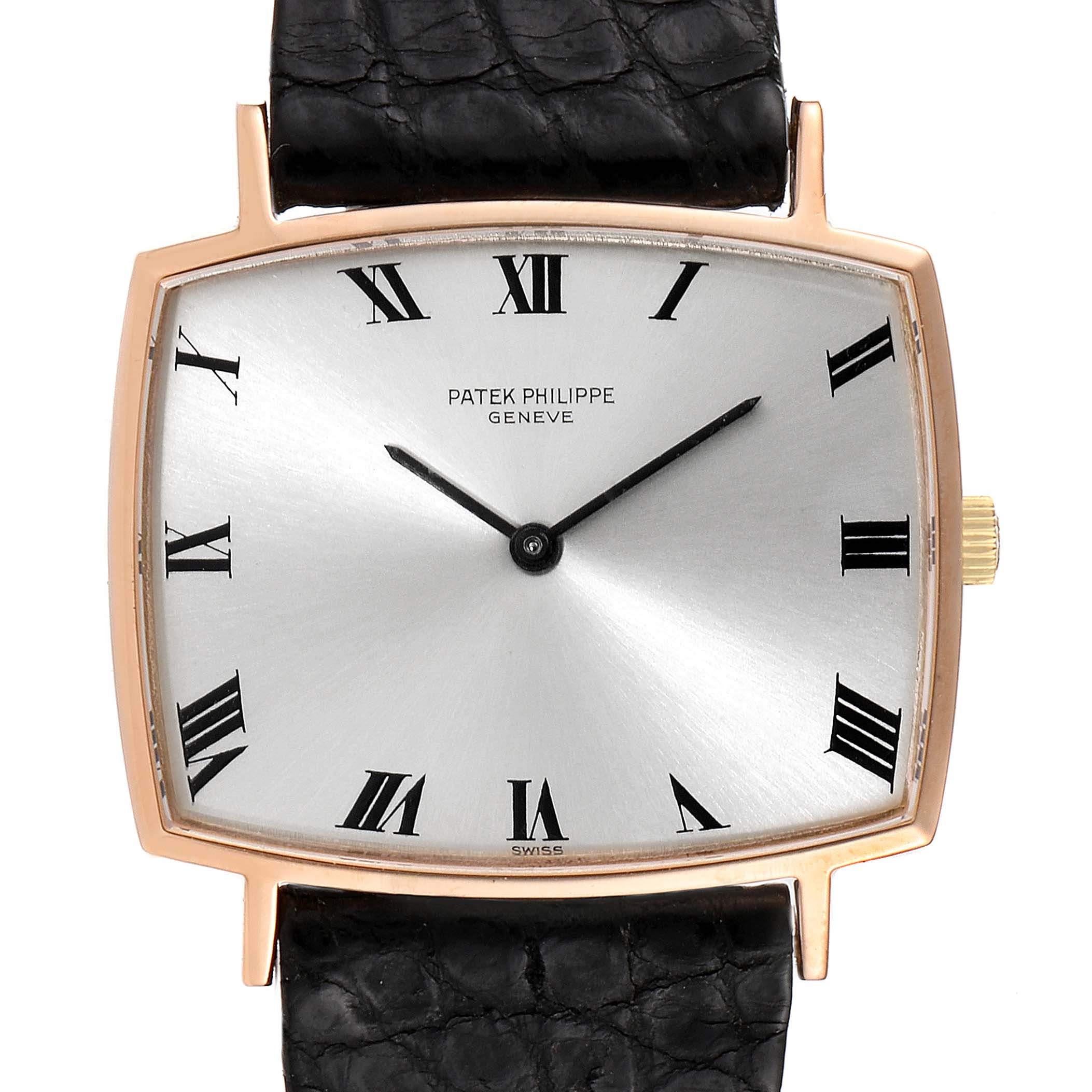 The image shows a front view of a vintage Patek Philippe watch with a silver dial, black Roman numerals, and a black leather strap.