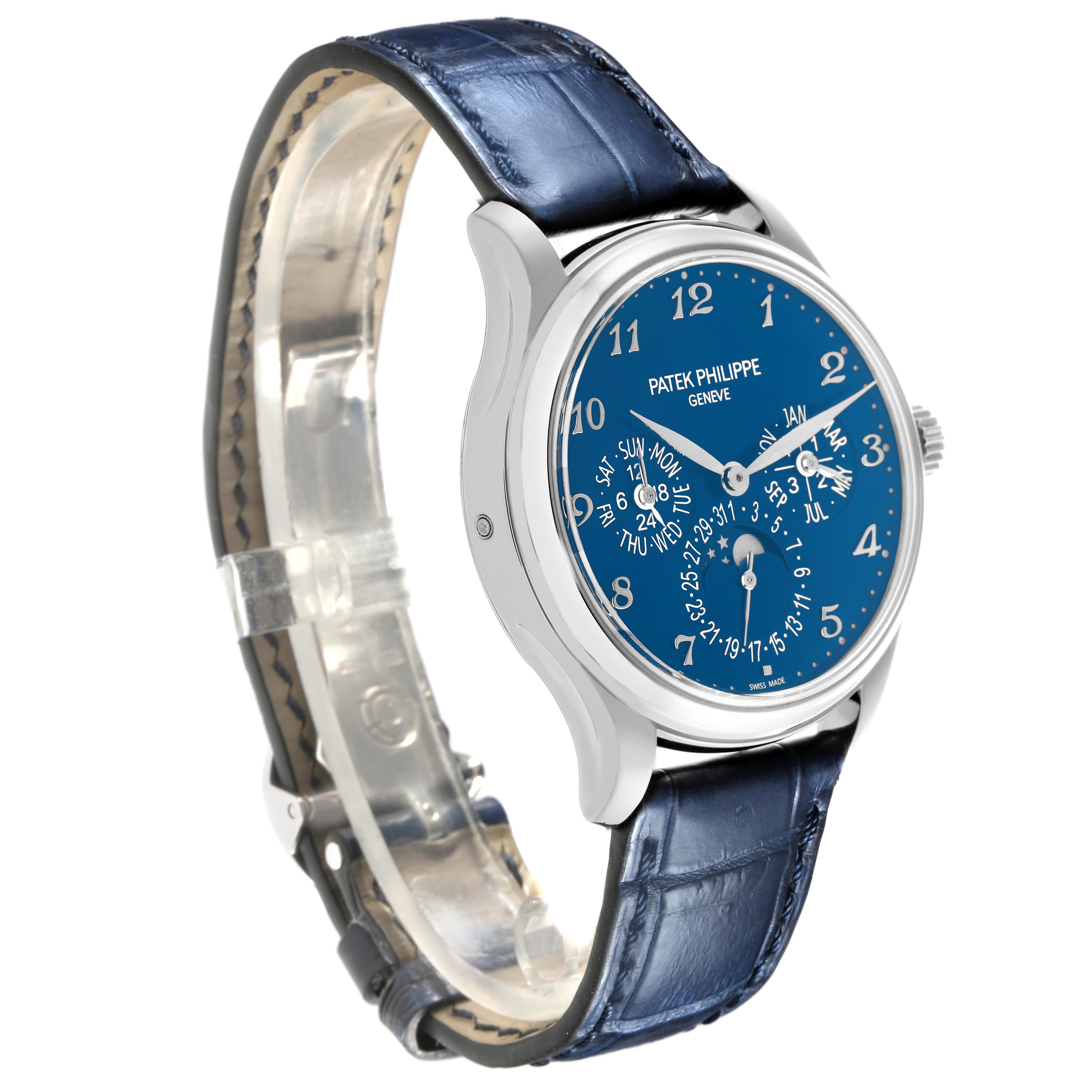 The Patek Philippe Complications 5327G-001 Men's White Gold Blue Dial watch is shown at a three-quarter angle, highlighting the blue dial and leather strap.