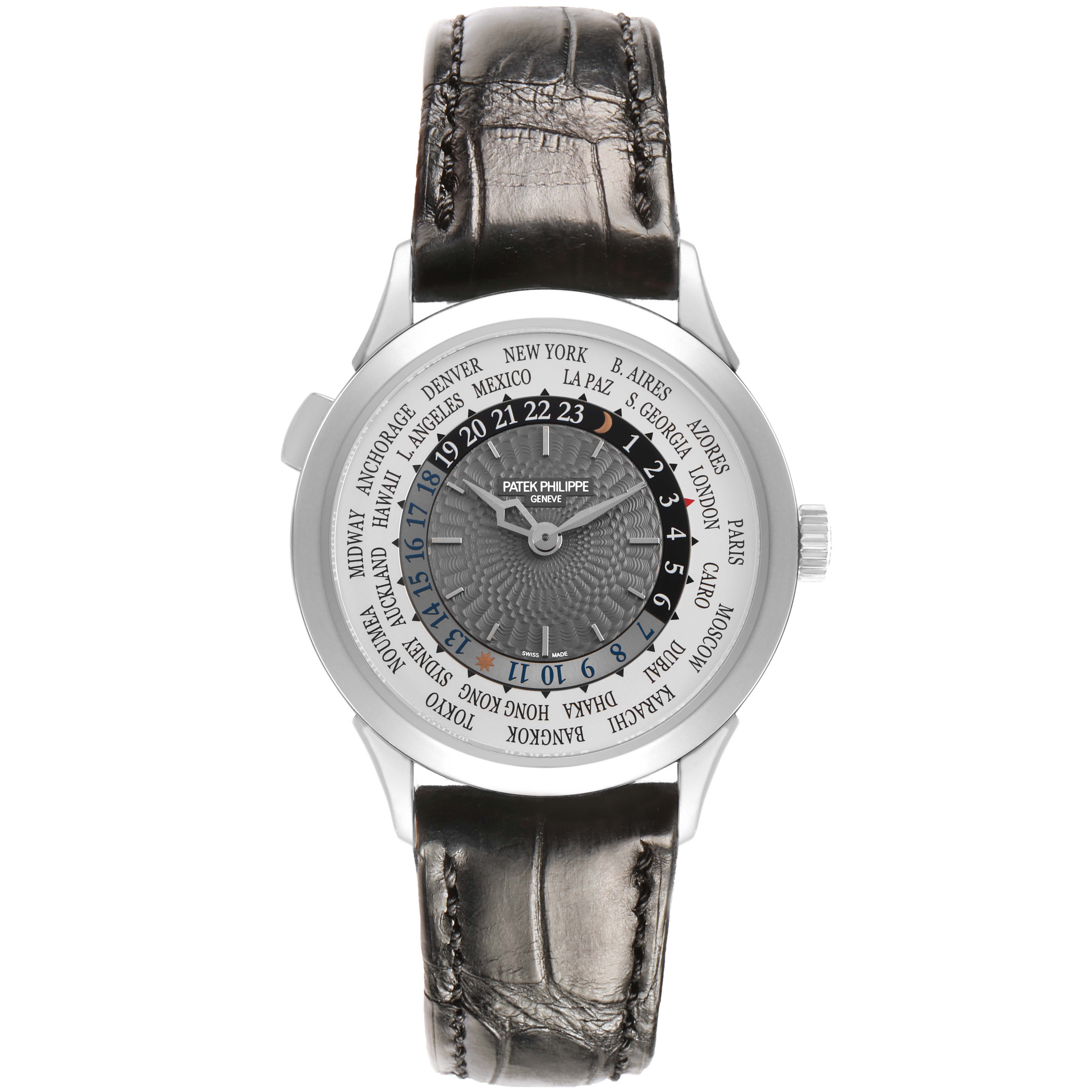 The Patek Philippe Complications 5230G Men's White Gold Grey Dial watch is shown from a frontal angle, highlighting the dial with time zone cities and a leather strap.