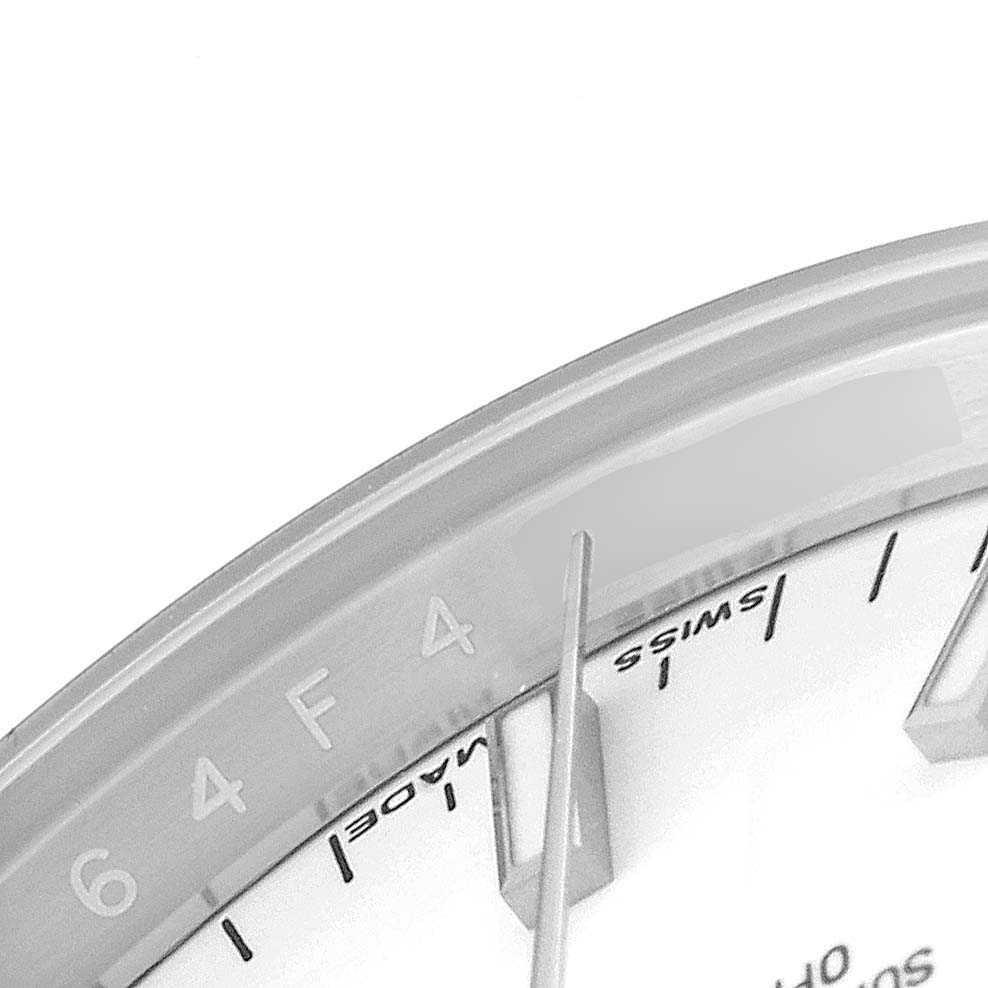 This is a close-up of the dial and hands of a Rolex Date 115200 Men's Stainless Steel White Dial 115200 Men's Stainless Steel White Dial model watch, focusing on the "SWISS MADE" text and hour markers.