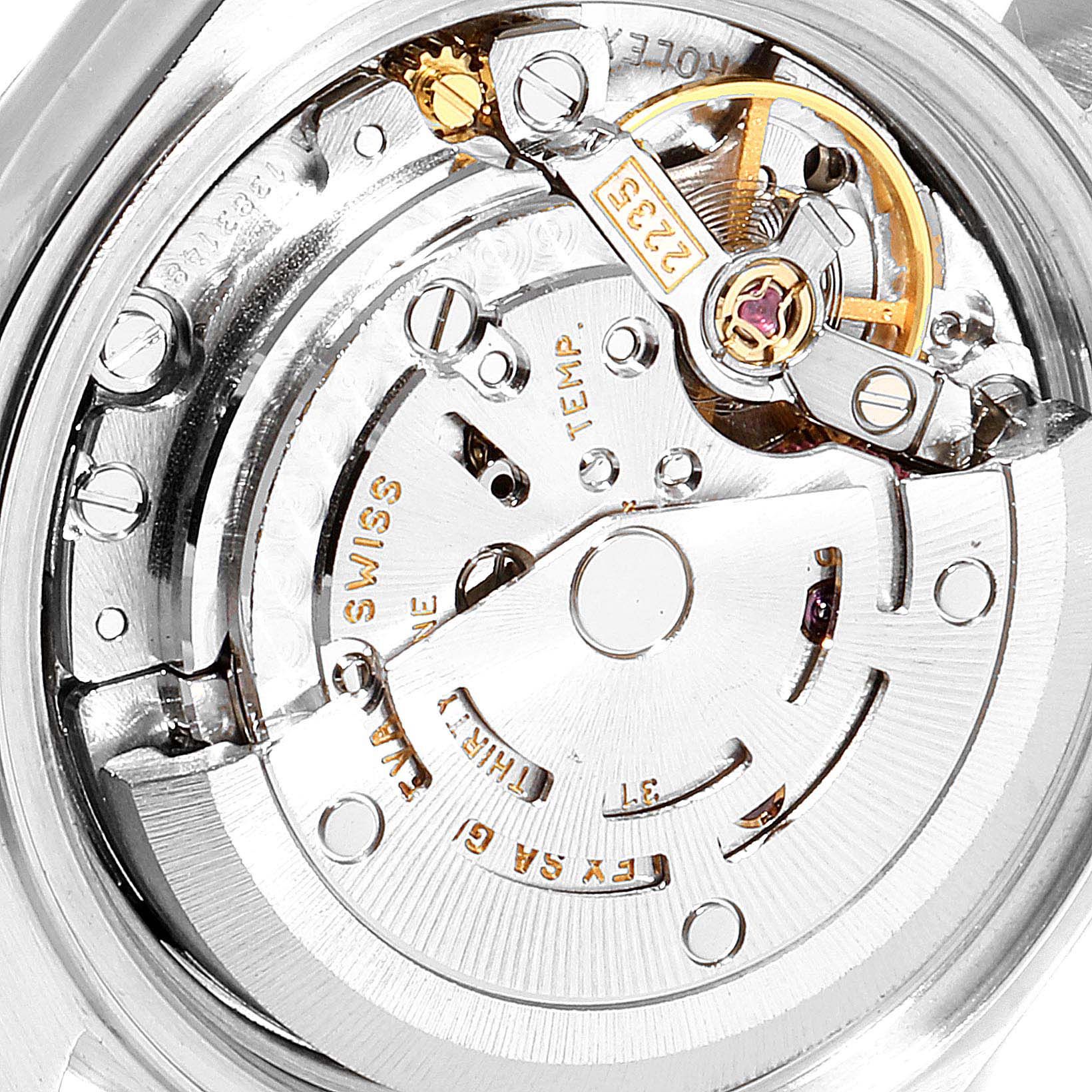 The image shows the intricate internal mechanics and movement of a Rolex Datejust 79174 Women's Stainless Steel Black Dial 79174 Women's Stainless Steel Black Dial watch from a close-up angle.