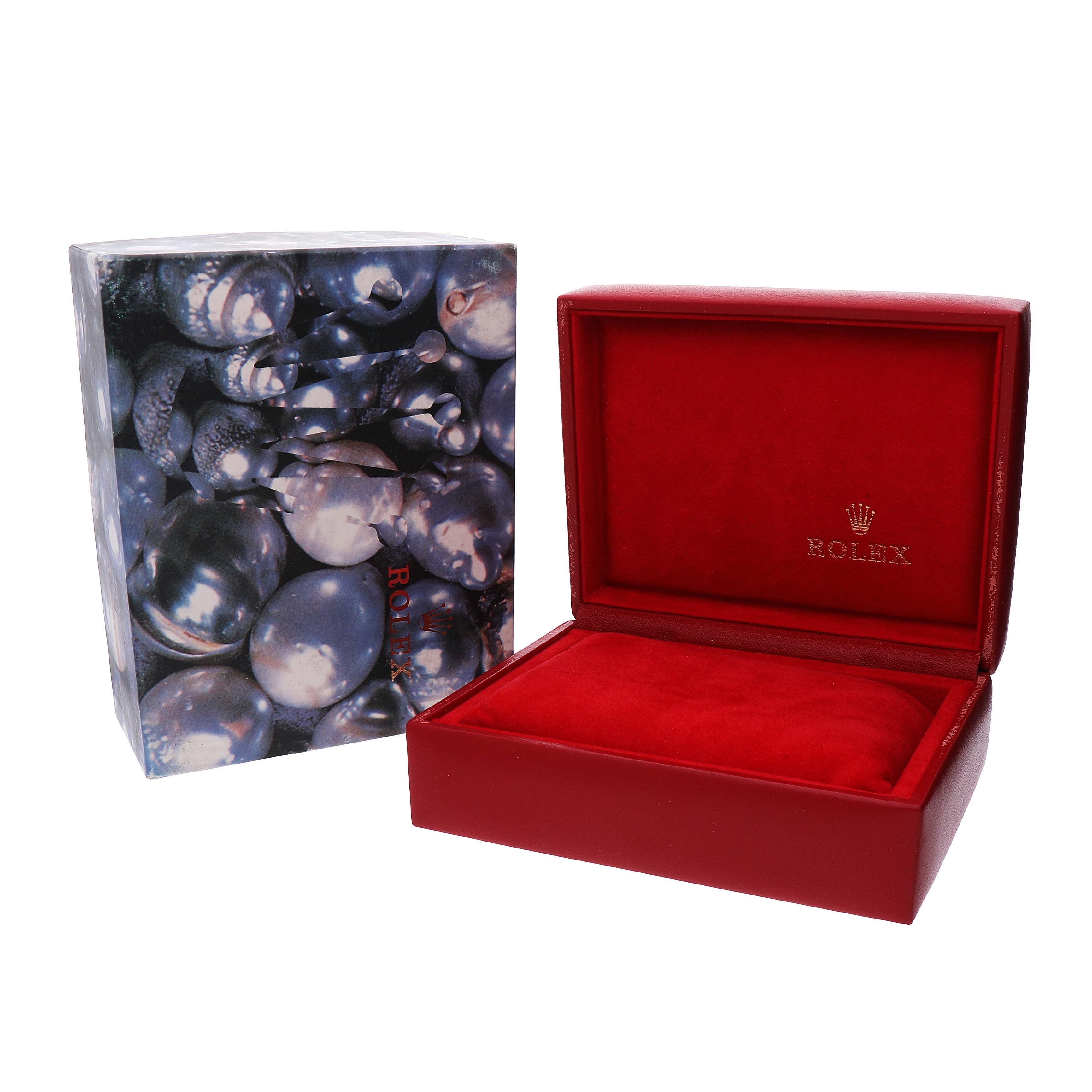 The image shows a Rolex Datejust 69173 Women's Steel and Gold (two tone) Champagne Dial watch box, open to display a red interior, with an outer box featuring a pearl design.