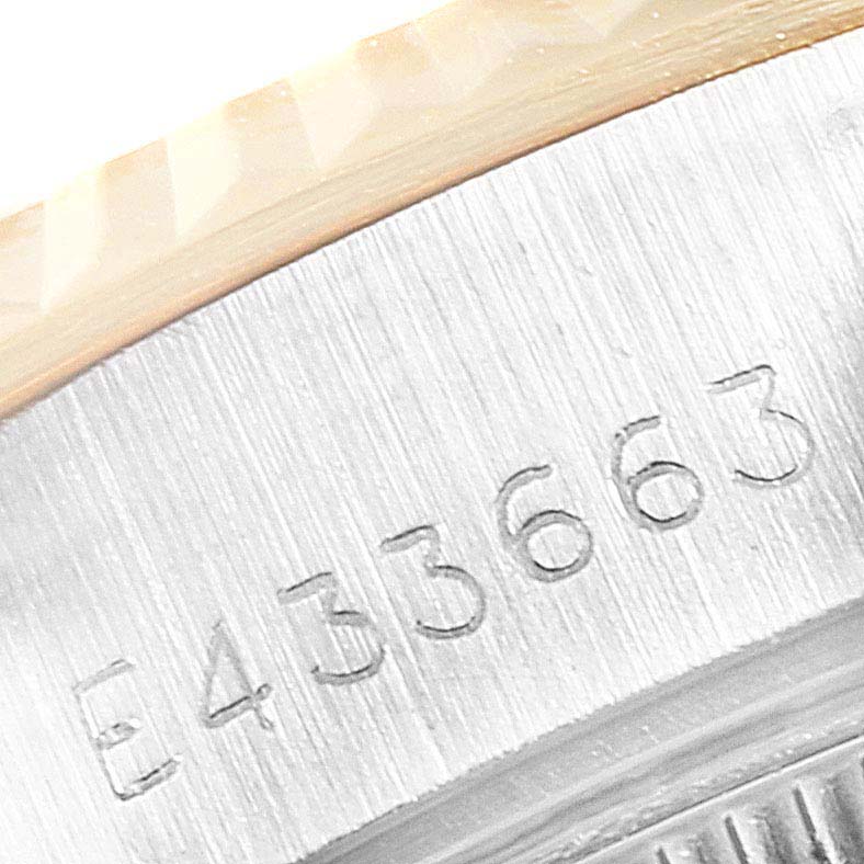 This image shows a close-up of the Rolex Datejust 69173 Women's Stainless Steel Champagne Dial 69173 Women's Stainless Steel Champagne Dial model's serial number engraved on its case.