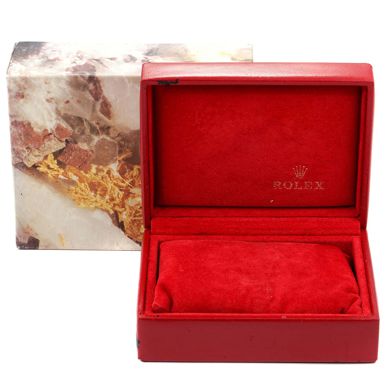 Shown at a front angle, this image features a red Rolex Datejust 69173 Women's Stainless Steel Champagne Dial 69173 Women's Stainless Steel Champagne Dial watch box with the lid open and a partial view of its outer box.