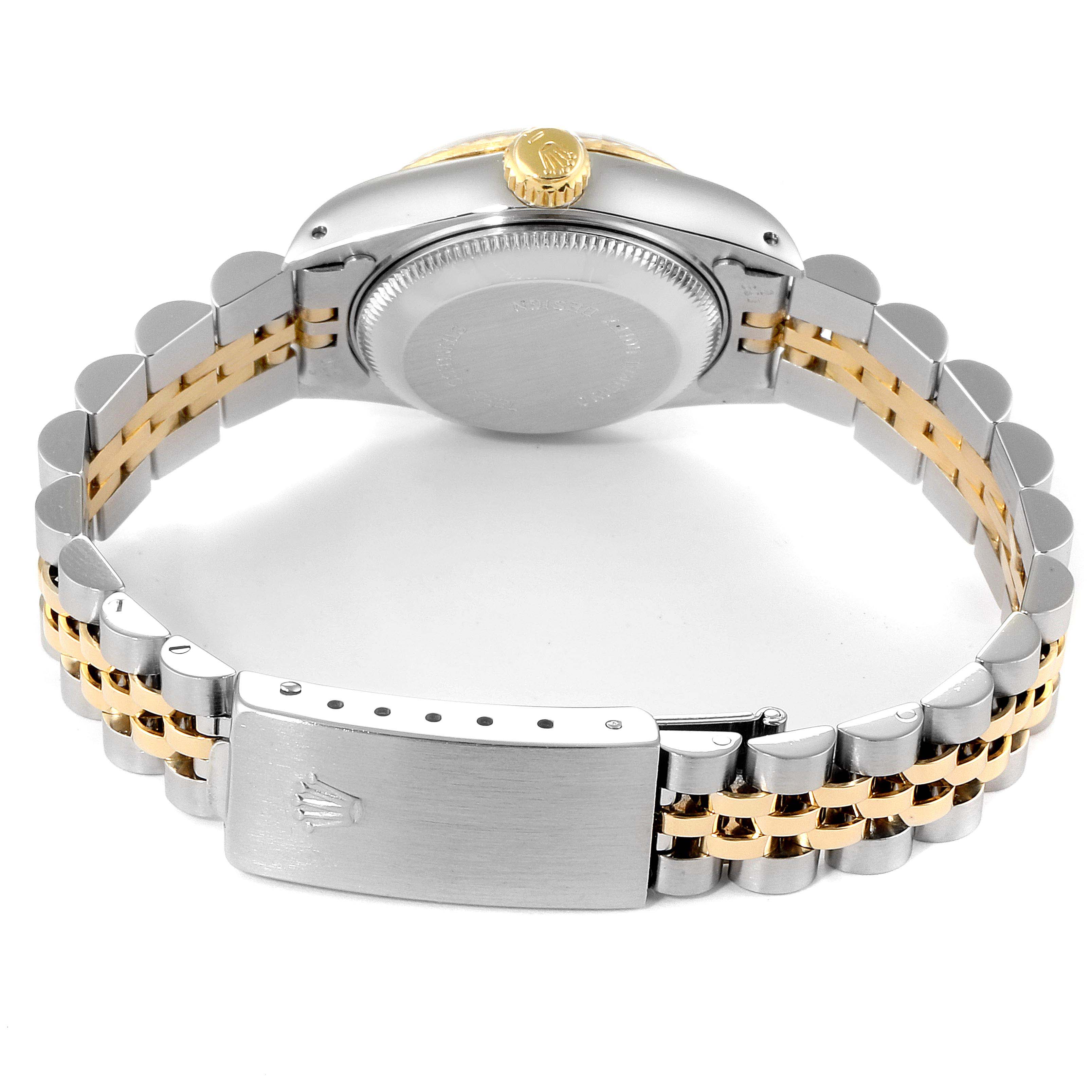 The image shows the back view of the Rolex Datejust 69173 Women
s Steel and Gold (two tone) Champagne Dial 69173 Women
s Steel and Gold (two tone) Champagne Dial watch, highlighting its clasp, bracelet, and case back.