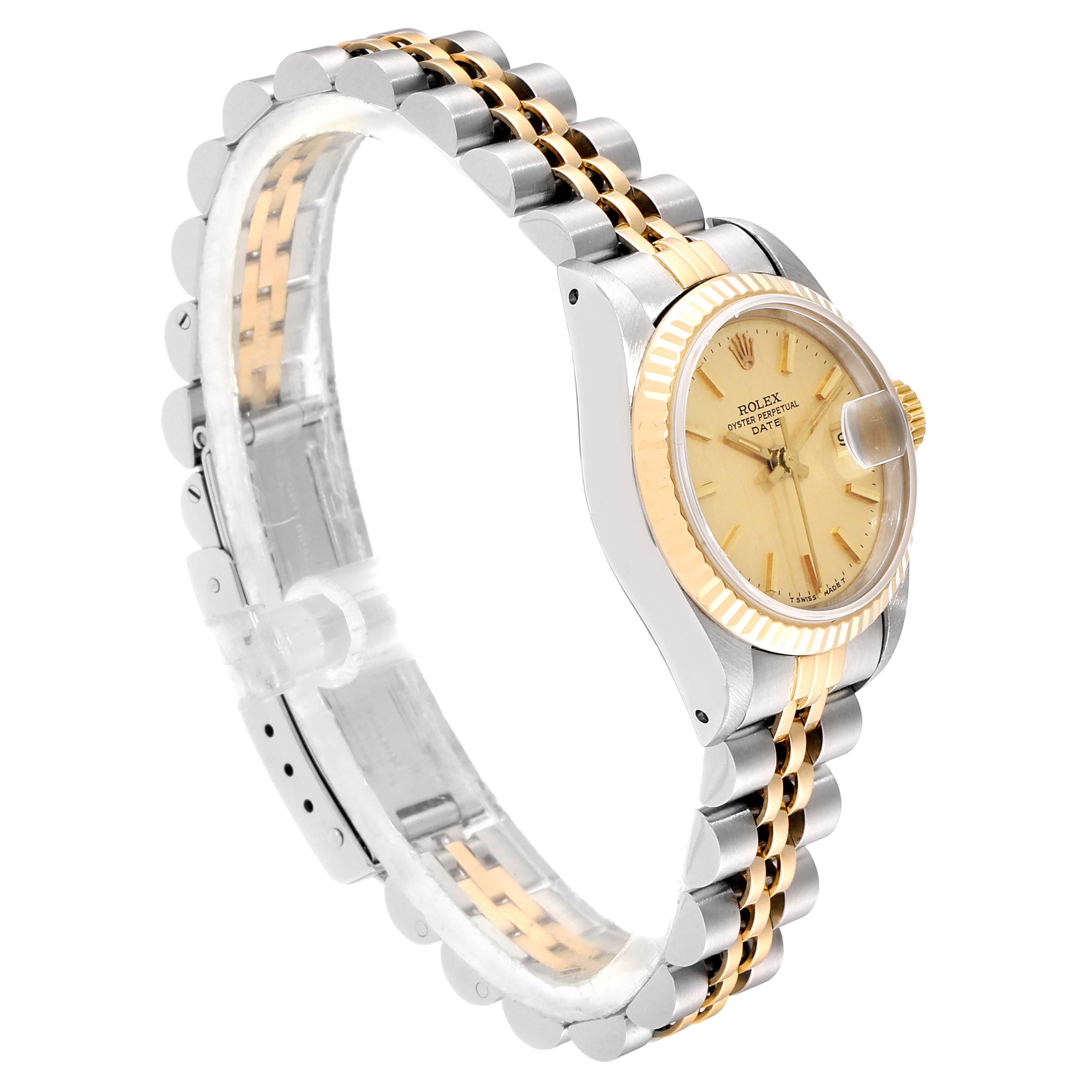 This image shows a Rolex Datejust 69173 Women
s Steel and Gold (two tone) Champagne Dial 69173 Women
s Steel and Gold (two tone) Champagne Dial watch at a side angle, featuring its jubilee bracelet, fluted bezel, and champagne dial with a date window.
