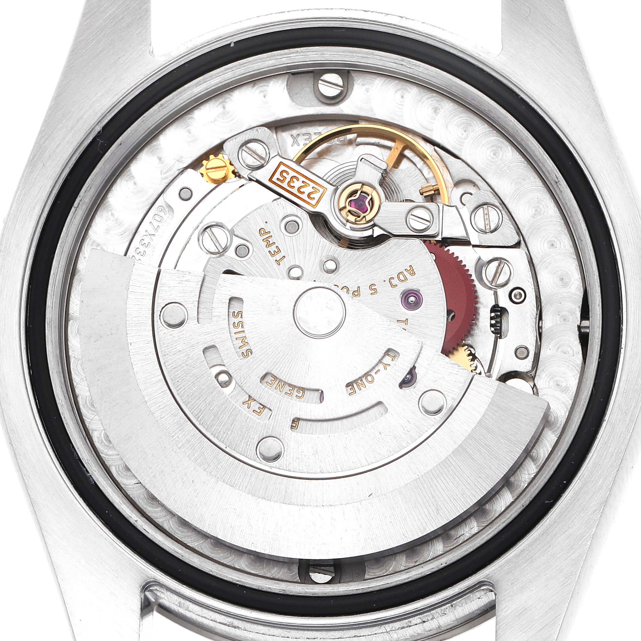 The image shows the movement of a Rolex Mid-Size 178274 Women
s Stainless Steel Black Dial 178274 Women
s Stainless Steel Black Dial watch from a rear angle, highlighting the rotor and gears.