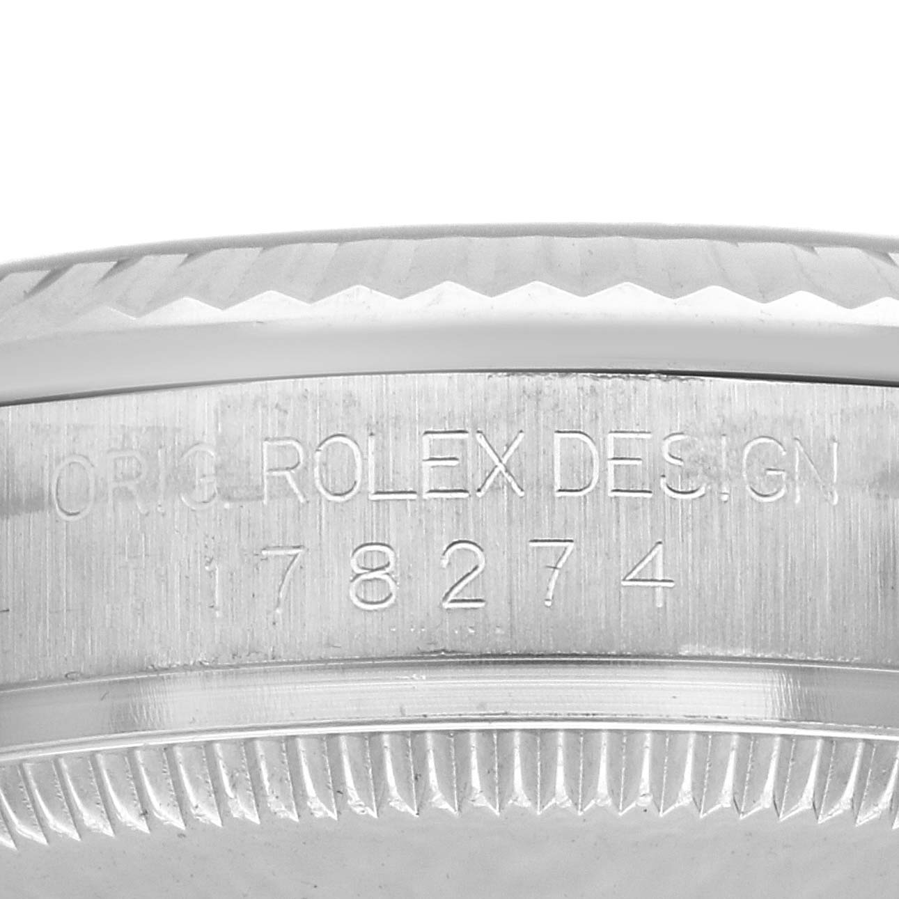 This image shows a close-up of the case side and bezel of a Rolex Mid-Size 178274 Women
s Stainless Steel Black Dial 178274 Women
s Stainless Steel Black Dial watch, highlighting the engraved model number.