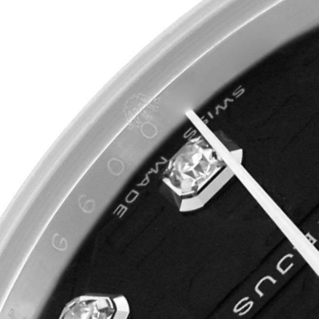 The image shows a close-up of the Rolex Mid-Size 178274 Women
s Stainless Steel Black Dial 178274 Women
s Stainless Steel Black Dial watch dial featuring diamond hour markers and "Swiss Made" text.
