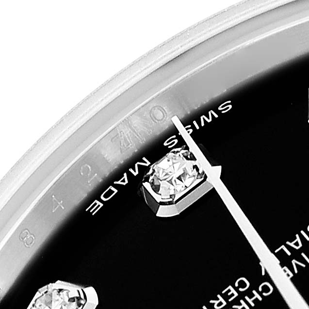 The image shows a close-up of the face of a Rolex Mid-Size 178274 Women's Stainless Steel Black Dial 178274 Women's Stainless Steel Black Dial watch, highlighting a diamond hour marker and part of the minute hand.
