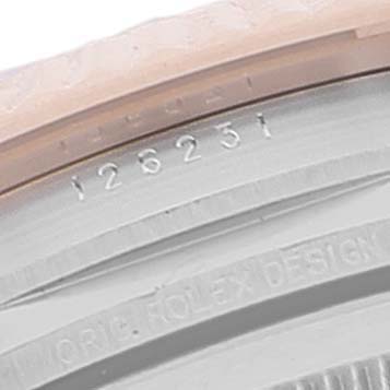 The image shows a close-up angle of the case back of a Rolex Datejust 126231 Men
s Steel and Gold (two tone) Grey Dial 126231 Men
s Steel and Gold (two tone) Grey Dial model, highlighting the serial number and engraved text.