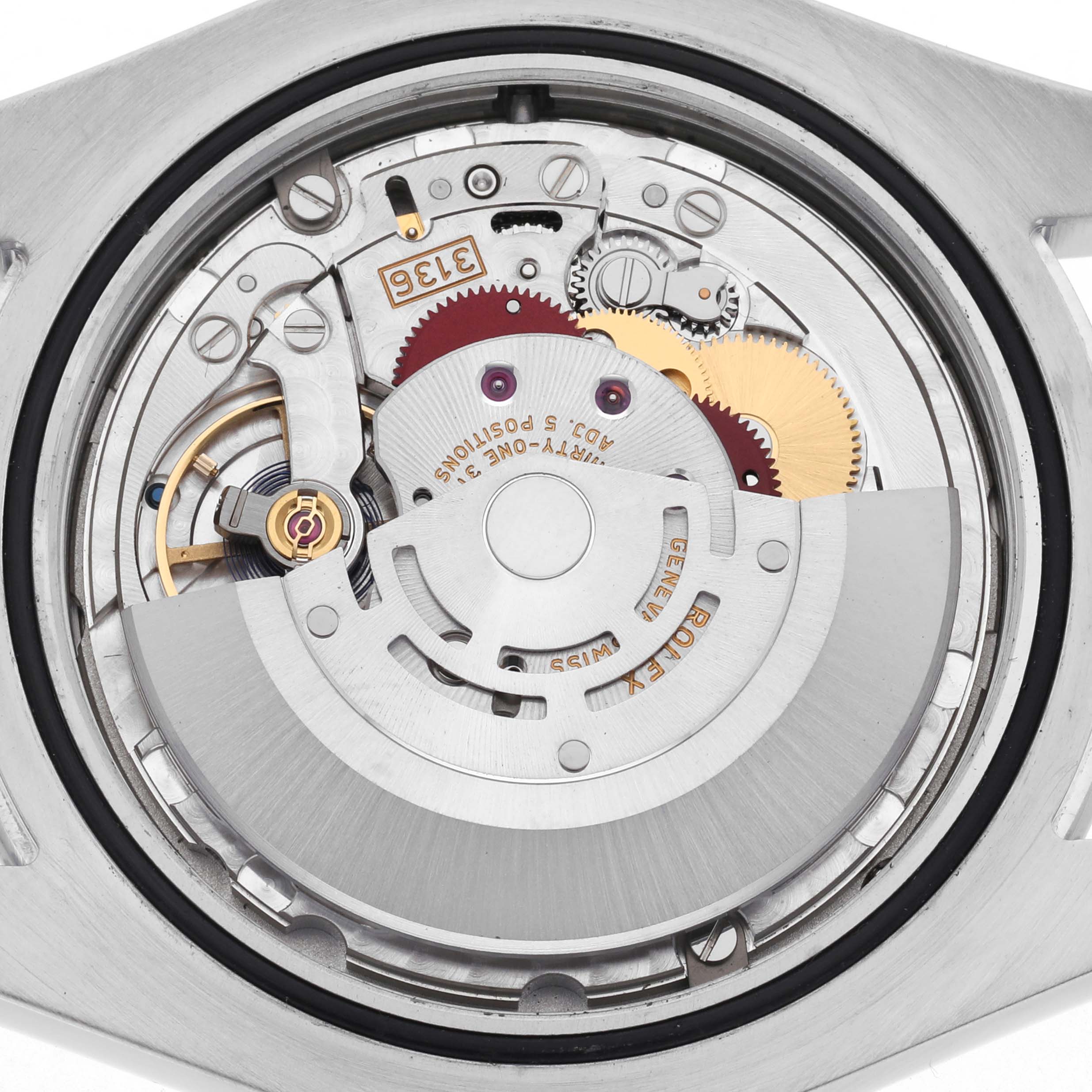 The image shows the internal mechanism of a Rolex Datejust 41 116300 Men
s Stainless Steel Silver Dial 116300 Men
s Stainless Steel Silver Dial, highlighting gears and the rotor from a back view.